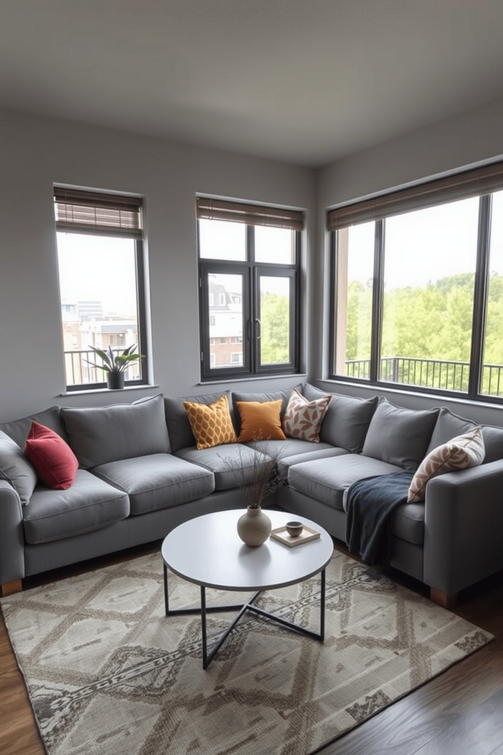 A cozy living room featuring a sectional sofa designed for optimal seating. The sofa is upholstered in a soft gray fabric and adorned with colorful throw pillows for added comfort. The layout is an L-shaped apartment design maximizing space and functionality. Large windows allow natural light to flood the area, highlighting a stylish coffee table in front of the sofa.