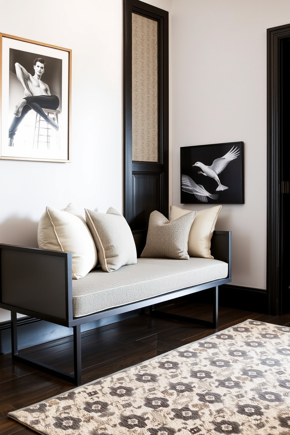 A sleek bench with soft cushions and pillows is positioned in a spacious entryway. The walls are adorned with elegant artwork and the floor features a stylish patterned rug that complements the overall design.