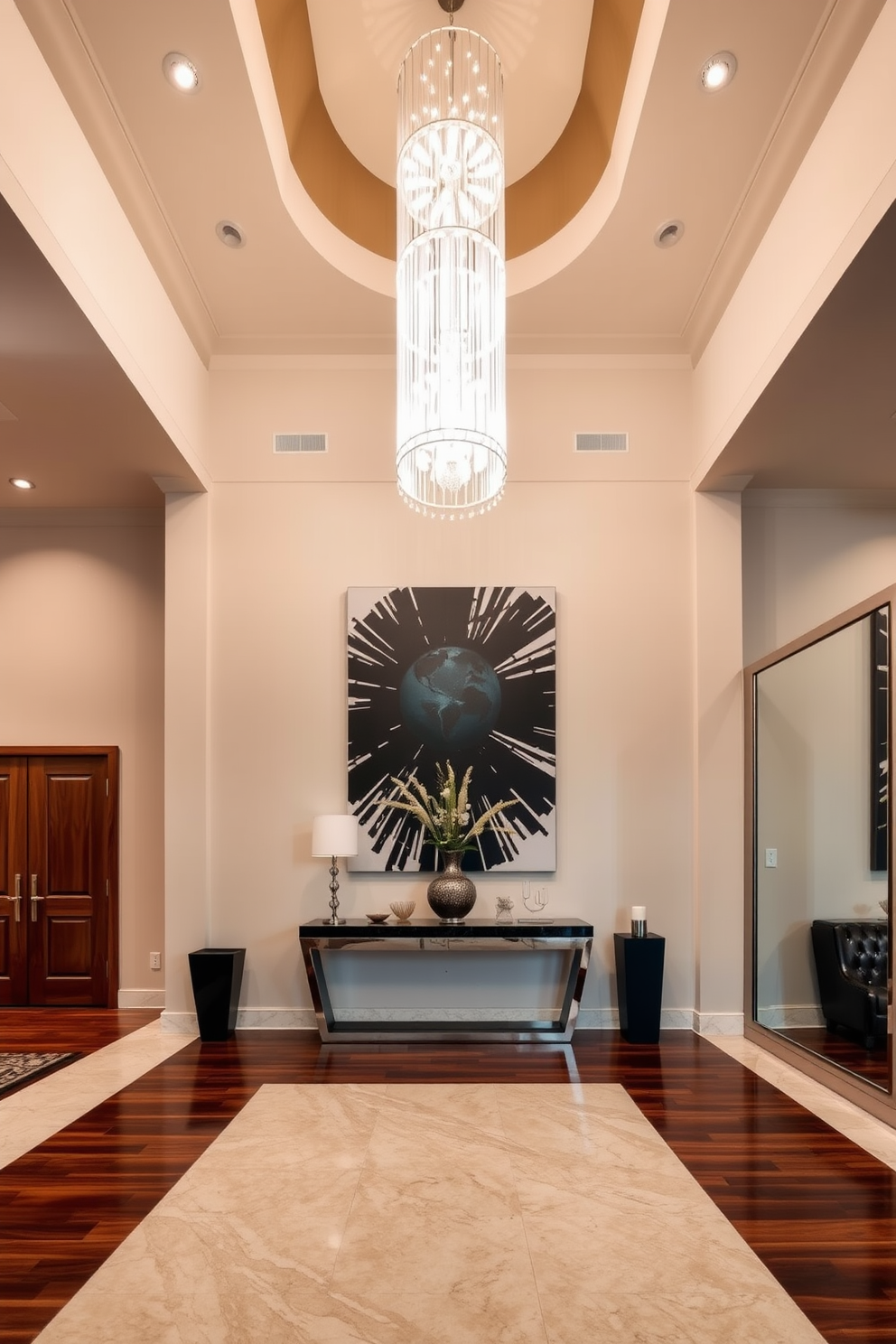 A grand foyer featuring a high ceiling and an elegant chandelier that cascades light throughout the space. The walls are adorned with bold artwork that serves as a striking statement piece, drawing the eye and adding character to the entrance. The flooring is a mix of polished marble and rich hardwood, creating a warm yet sophisticated atmosphere. A stylish console table sits against one wall, complemented by decorative accents and a large mirror that enhances the sense of space.