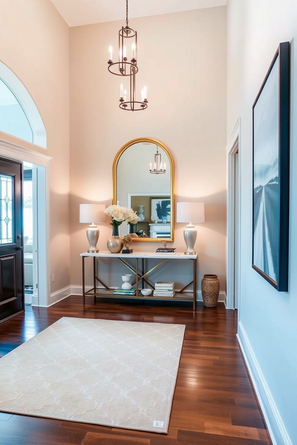 A stylish area rug anchors the space, featuring a geometric pattern in soft earth tones that complements the surrounding decor. The foyer boasts high ceilings with elegant light fixtures, and a console table adorned with decorative accents welcomes guests. Incorporating large foyer design ideas, the walls are adorned with artwork that adds character and warmth to the entryway. A statement mirror above the console table enhances the sense of space and light, creating an inviting atmosphere.