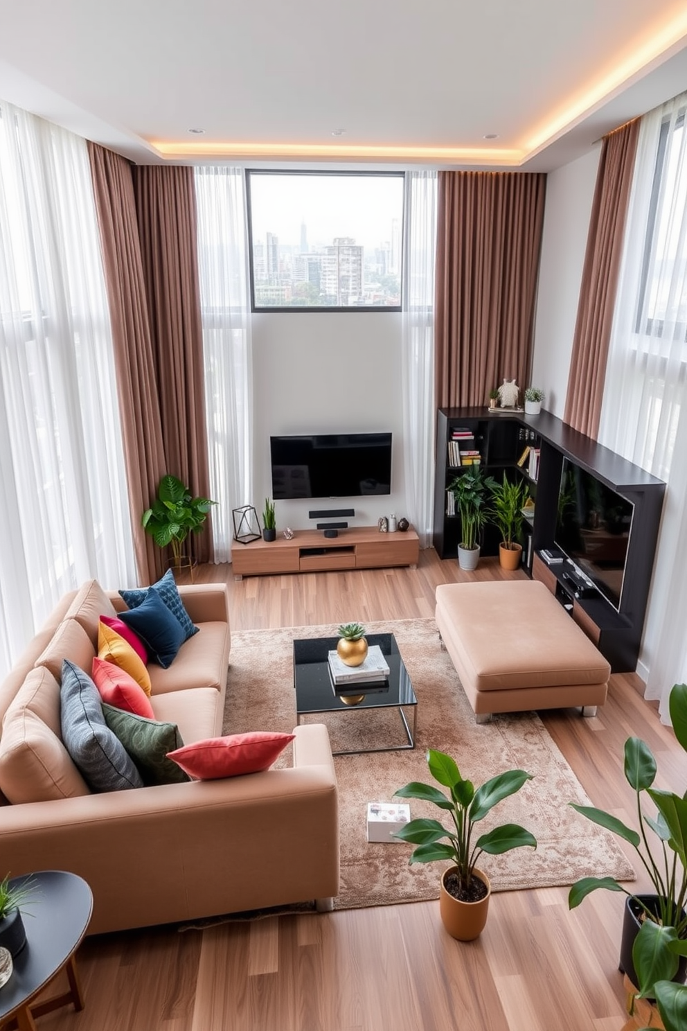 A spacious living room with large windows framed by elegant curtains that cascade to the floor. The room features a plush sectional sofa in a neutral tone, complemented by colorful accent pillows and a stylish coffee table at the center. On one side of the room, a sleek entertainment unit houses a modern flat-screen TV and decorative shelves filled with books and art pieces. A cozy area rug anchors the seating arrangement, while indoor plants add a touch of greenery and warmth to the space.