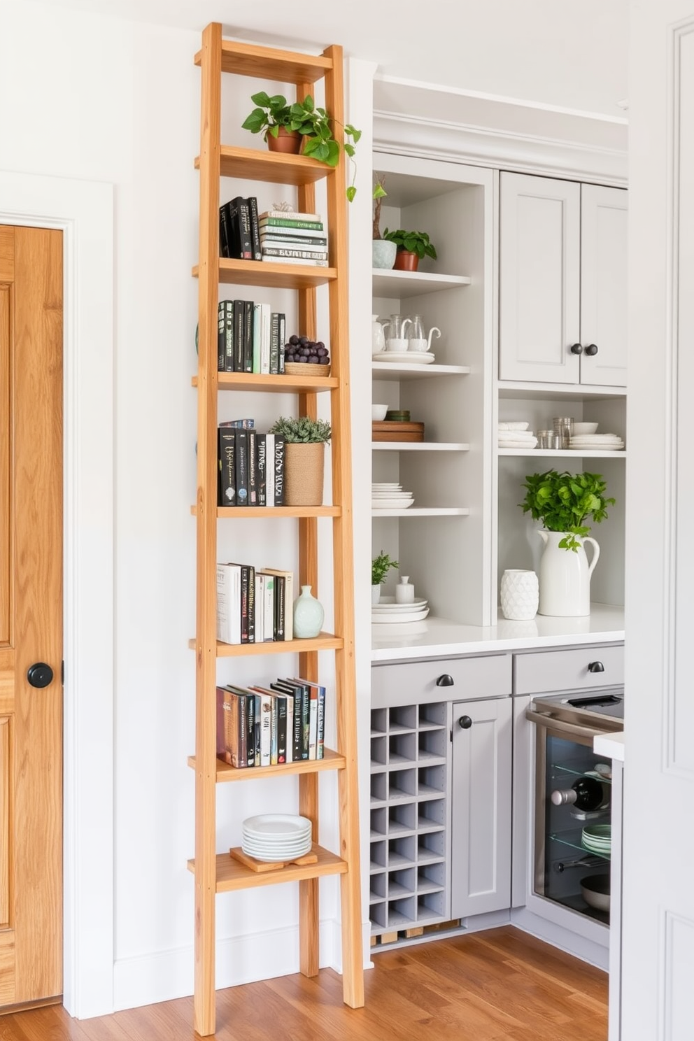 A stylish ladder shelf made of natural wood stands against a bright white wall. It features multiple shelves filled with neatly arranged books, decorative plants, and curated decor items. The large pantry is designed with custom cabinetry in a soft gray finish. It includes pull-out shelves, a built-in wine rack, and ample space for storing kitchen essentials and pantry items.