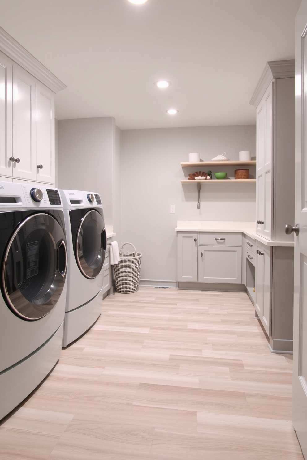 A practical laundry room basement design features durable flooring options such as luxury vinyl planks or ceramic tiles to withstand heavy use. The walls are painted in a light gray hue, creating a bright and inviting atmosphere, while ample storage solutions are integrated into the space for optimal organization.