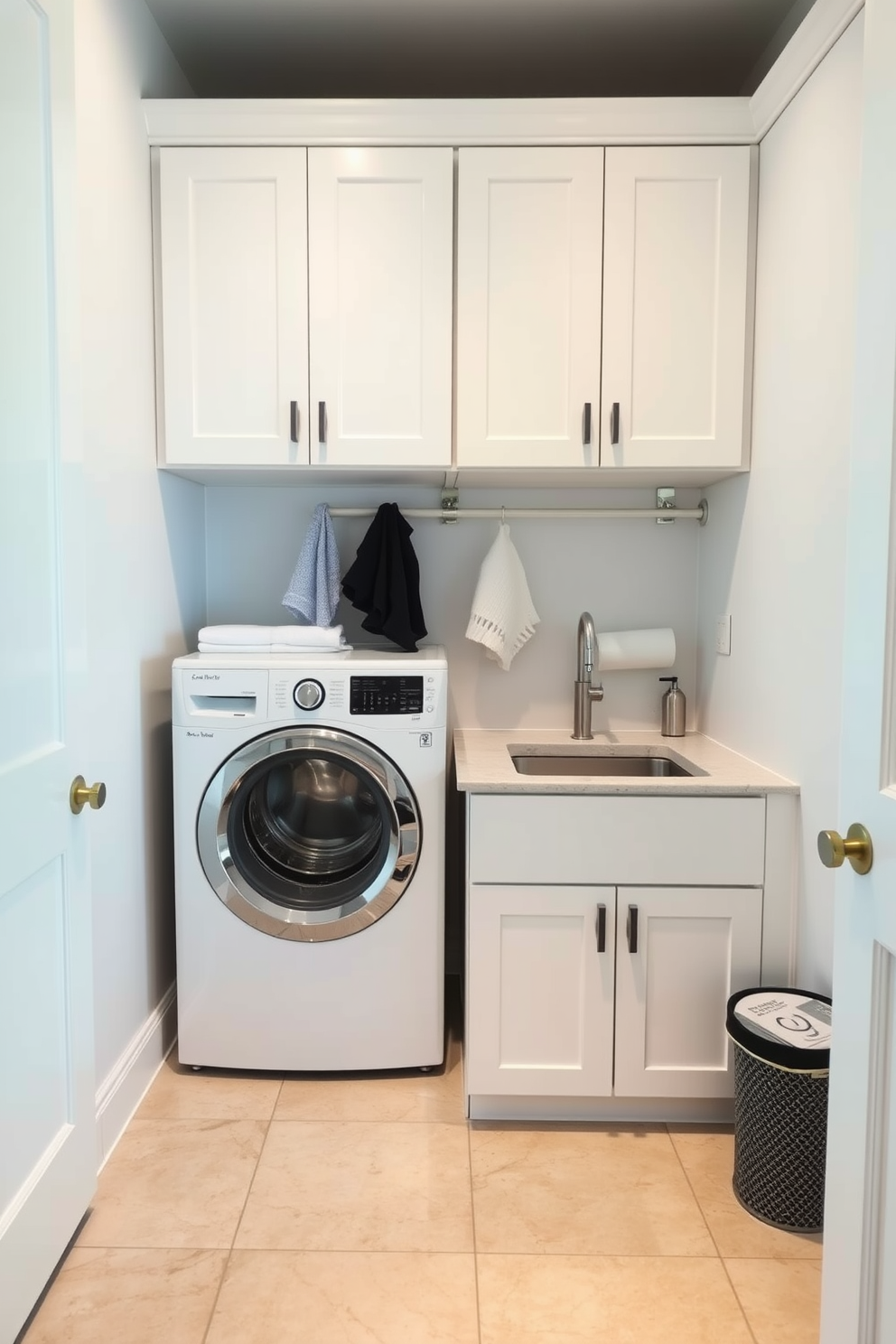 A functional laundry room designed for durability and efficiency. The space features a robust countertop made of quartz, ideal for folding clothes, with ample storage cabinets above in a sleek white finish. The floor is covered in large-format porcelain tiles that resist stains and wear, ensuring easy maintenance. A utility sink is integrated into the cabinetry, providing convenience for pre-treating stains and cleaning up.