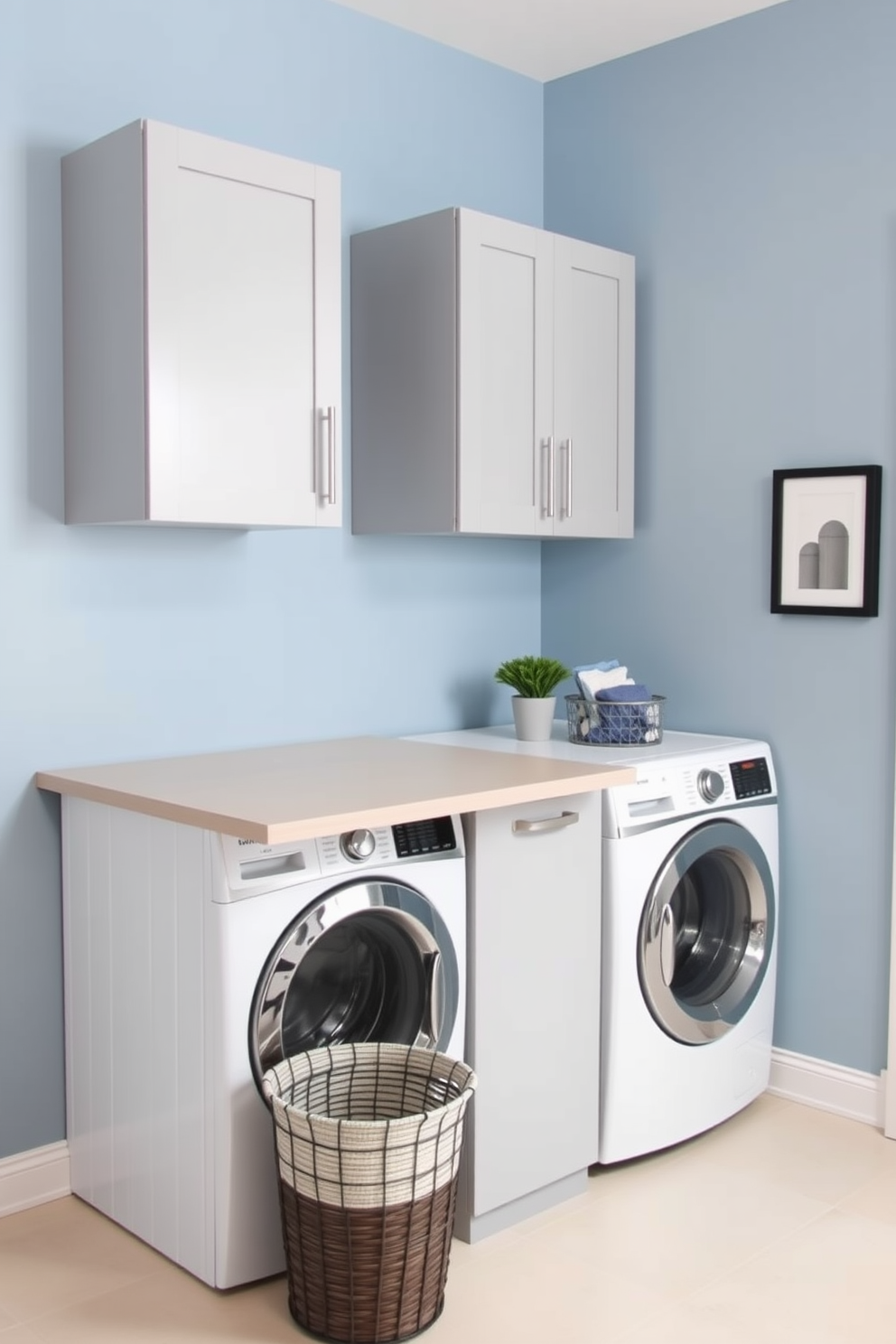 A modern laundry room featuring a built-in folding table for convenience. The space includes a stacked washer and dryer setup, with sleek cabinetry above for storage. The walls are painted in a soft blue hue, creating a calming atmosphere. A stylish basket for laundry sits next to the folding table, and a small potted plant adds a touch of greenery.