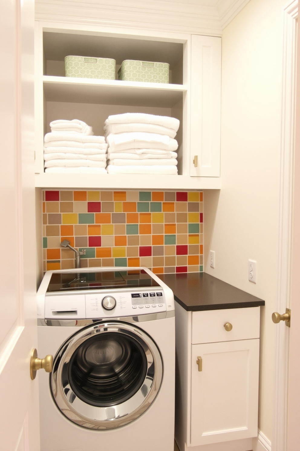 A vibrant laundry room features a top-loading washer surrounded by a colorful backsplash that adds a cheerful touch to the space. The walls are painted in a soft white to enhance the brightness, while open shelving above the washer displays neatly folded towels and decorative storage bins.