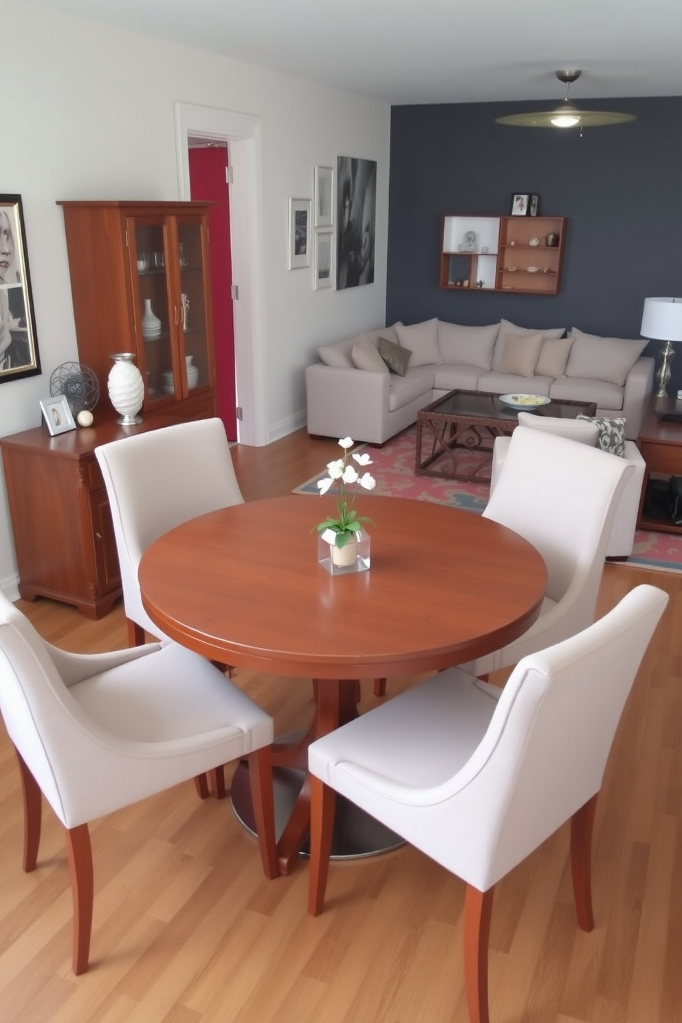 A compact dining set designed for tight spaces features a round table with a sleek wooden finish surrounded by four upholstered chairs. The arrangement is complemented by a small sideboard against the wall, providing additional storage while maintaining an open feel. In a living room dining room combo, a harmonious blend of comfort and functionality is achieved with a sectional sofa facing a stylish dining table. Decorative elements such as a vibrant area rug and contemporary light fixtures enhance the space, creating an inviting atmosphere for entertaining.