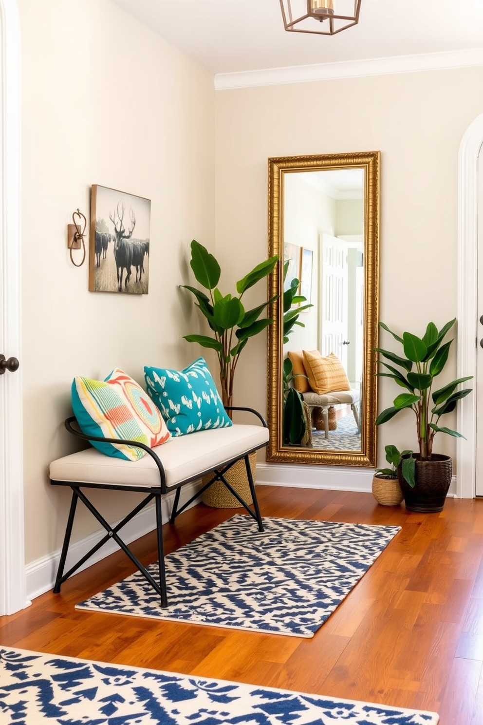 A chic bench is placed against the wall in the entryway, adorned with colorful cushions that add a vibrant touch to the space. The flooring is a warm wood, and a stylish area rug lies beneath the bench, enhancing the inviting atmosphere. On the opposite wall, a large mirror reflects natural light, making the entryway feel more spacious. Potted plants are positioned nearby, bringing a fresh and lively element to the design.