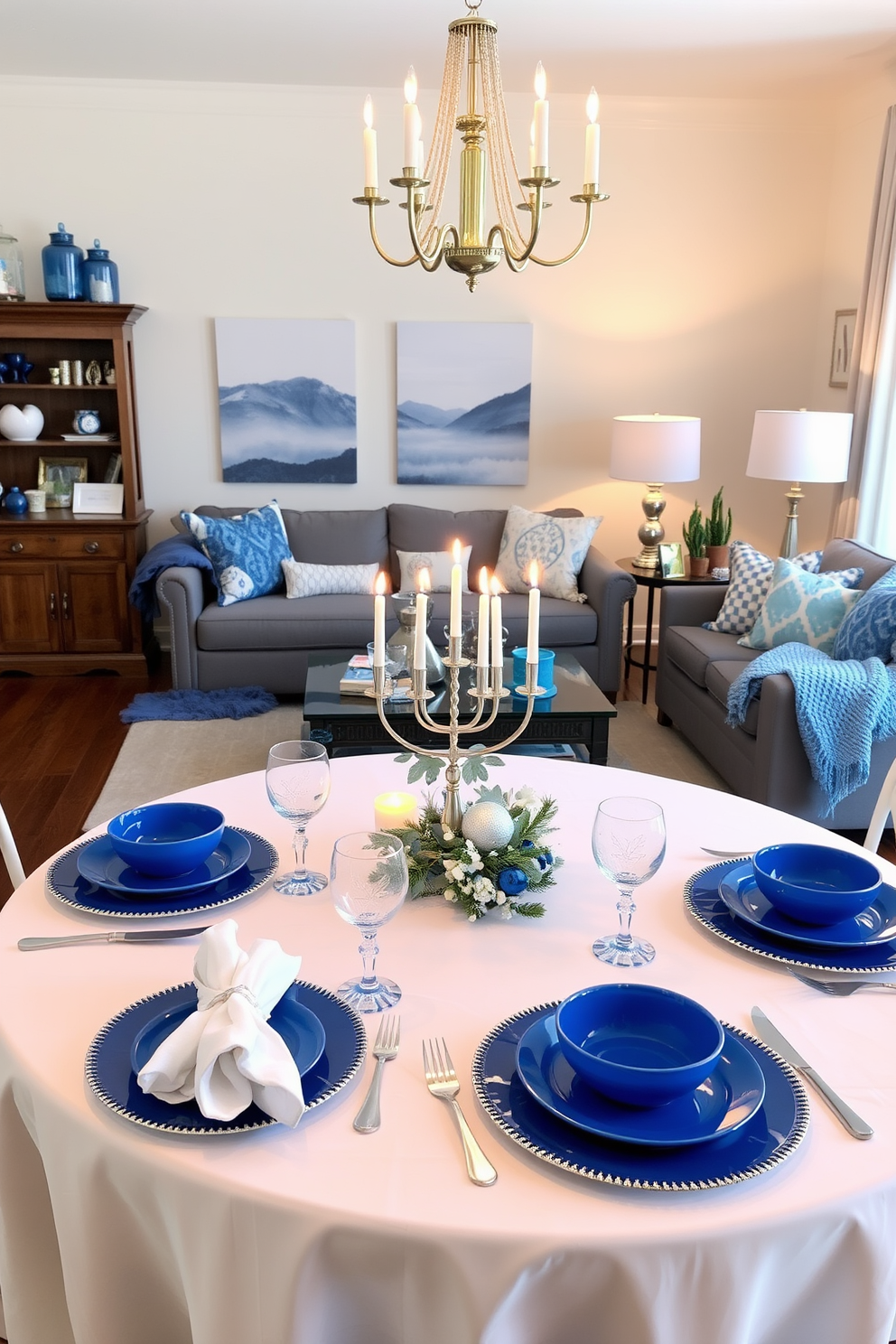 Elegant blue and white table settings. The table is elegantly set with a crisp white tablecloth and vibrant blue dinnerware, complemented by delicate white napkins folded neatly beside each plate. Living Room Hanukkah Decorating Ideas. The living room is adorned with soft blue and silver accents, featuring a beautifully lit menorah on the coffee table surrounded by festive decorations and cozy throw blankets.