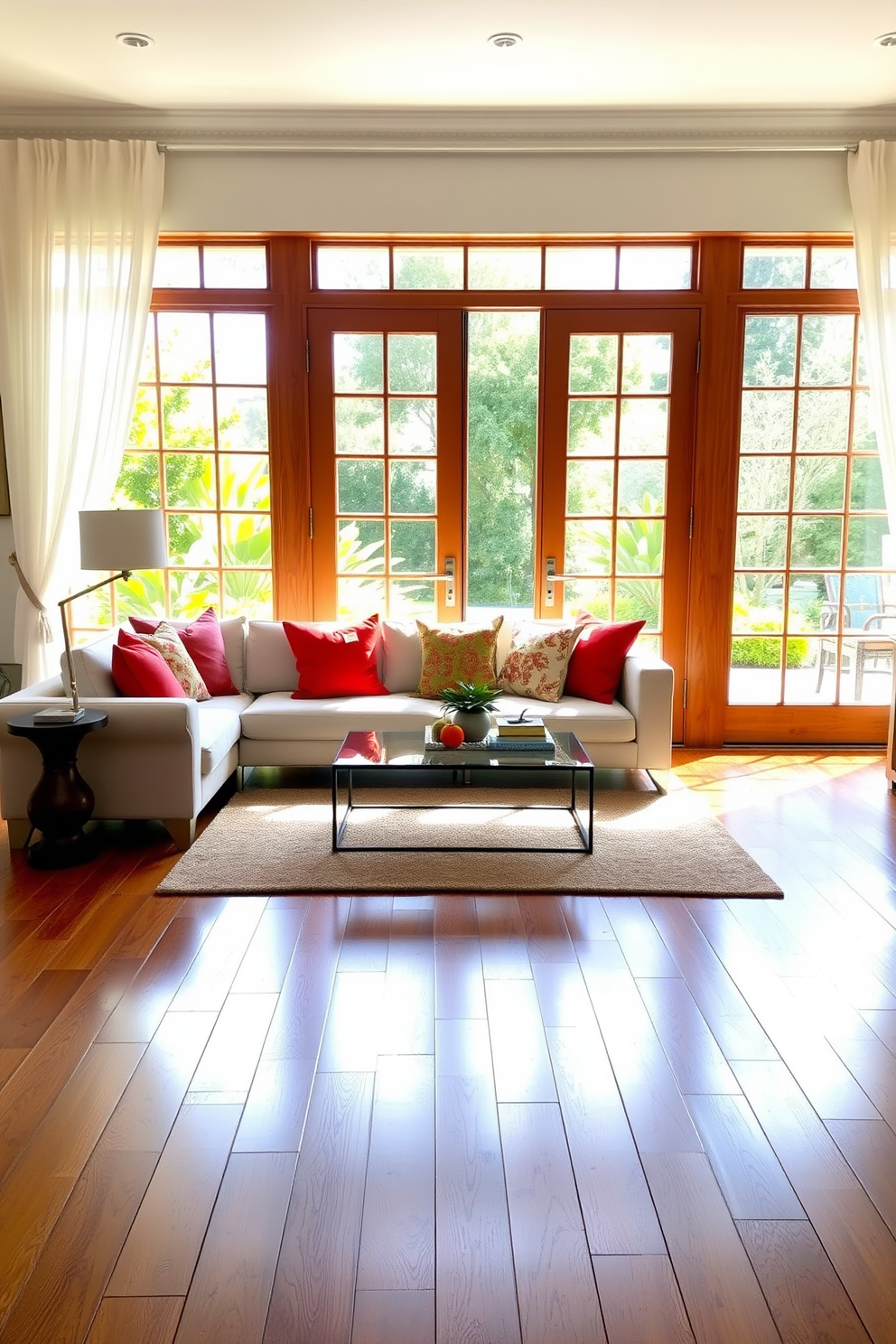 A bright and airy living room featuring elegant French doors that open to a lush outdoor space. The doors are framed by sheer white curtains, allowing natural light to flood the room and highlighting the rich hardwood flooring. The focal point of the room is a modern sectional sofa adorned with colorful throw pillows. A stylish coffee table sits in front of the sofa, complemented by a cozy area rug that adds warmth and texture to the space.