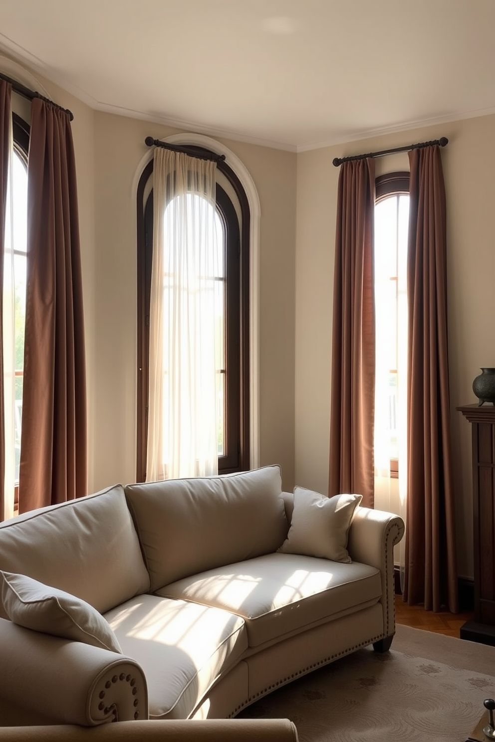 A cozy living room featuring arched windows that allow natural light to flood the space. The windows are adorned with elegant sheer curtains that gently sway with the breeze, enhancing the classic aesthetic. The walls are painted in a soft cream color, creating a warm backdrop for the room's furnishings. A plush sofa in a muted tone is positioned near the windows, inviting relaxation and conversation.