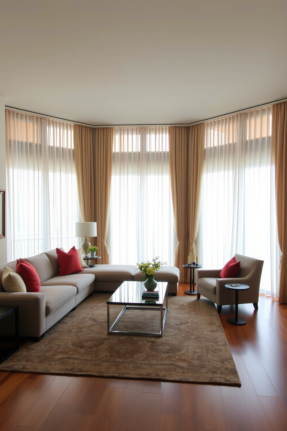 A long living room with large windows dressed in flowing curtains that soften the hard edges of the space. The room features a plush sectional sofa in a neutral tone, complemented by vibrant throw pillows and a sleek coffee table at the center. A cozy reading nook is created with a stylish armchair and a small side table, inviting relaxation. The walls are adorned with framed artwork, and a large area rug anchors the seating area, adding warmth and texture.