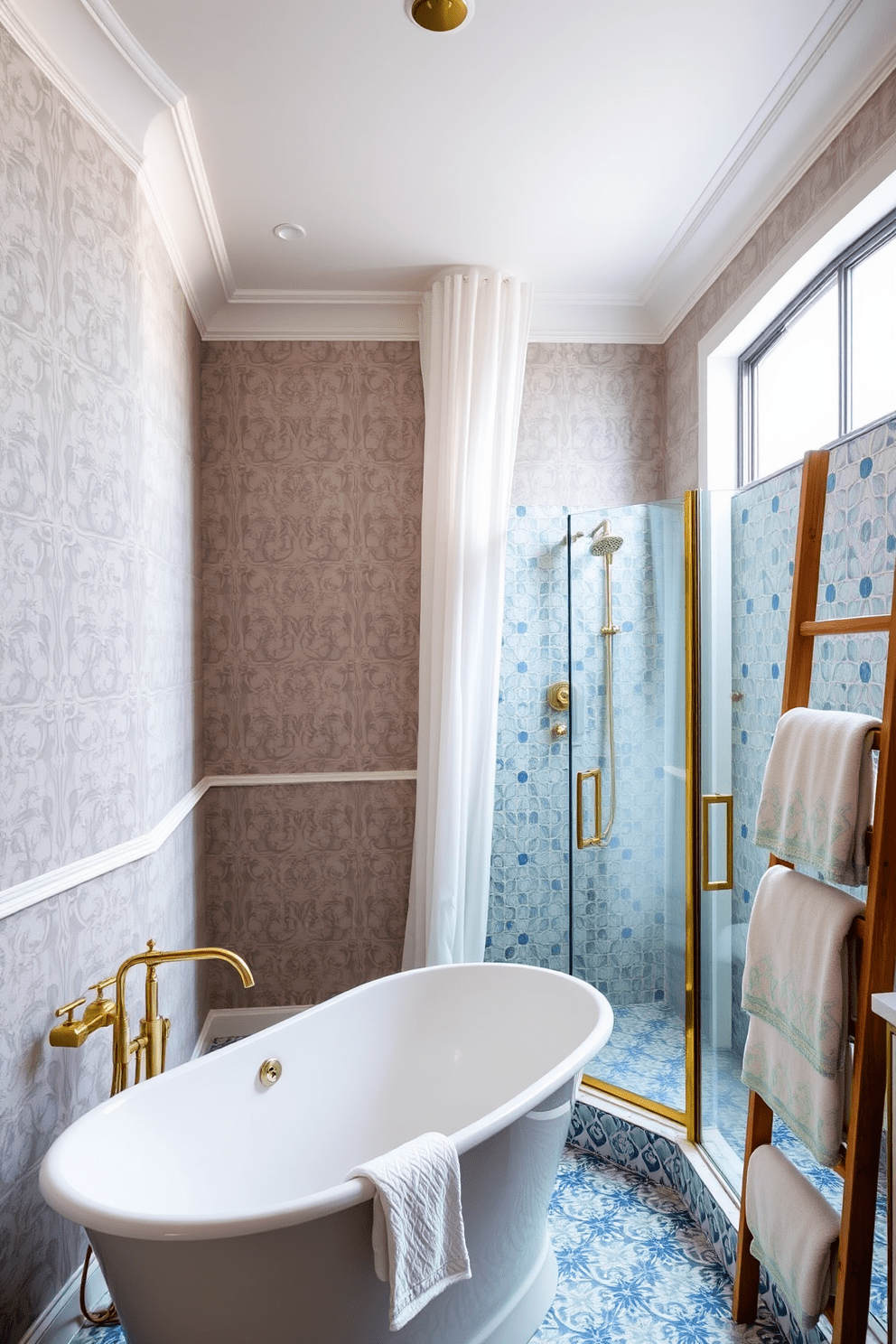 A luxury guest bathroom featuring a freestanding soaking tub positioned under a large window with sheer white curtains. The walls are adorned with elegant wallpaper in a soft gray hue, complemented by gold accents in the fixtures and accessories. A spacious walk-in shower with a glass enclosure showcases intricate tile work in shades of blue and white. Plush towels in coordinating colors are neatly arranged on a wooden ladder, adding a touch of warmth to the sophisticated space.