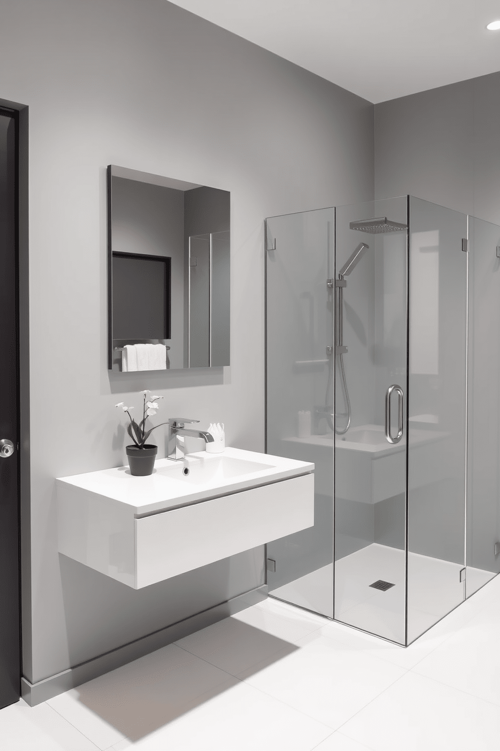 A sleek minimalist guest bathroom features a wall-mounted vanity with a smooth white countertop and a single integrated sink. The walls are painted in a soft gray, creating a serene atmosphere, while the floor is adorned with large format white tiles for a seamless appearance. A frameless glass shower enclosure showcases a rainfall showerhead and sleek chrome fixtures. Simple decor elements, such as a potted plant and neatly folded towels, add subtle touches of elegance without overwhelming the space.