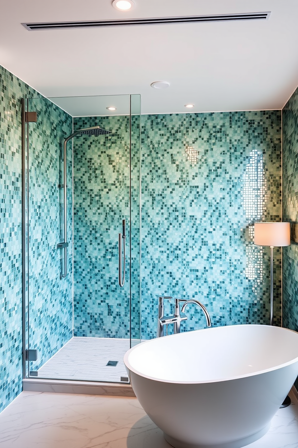 Chic glass-enclosed shower with mosaic tiles. The shower features a rainfall showerhead and a sleek glass door that opens to a spacious marble-floored area. The walls are adorned with shimmering mosaic tiles in shades of blue and green. A modern freestanding bathtub sits elegantly beside the shower, complemented by a stylish floor lamp nearby.