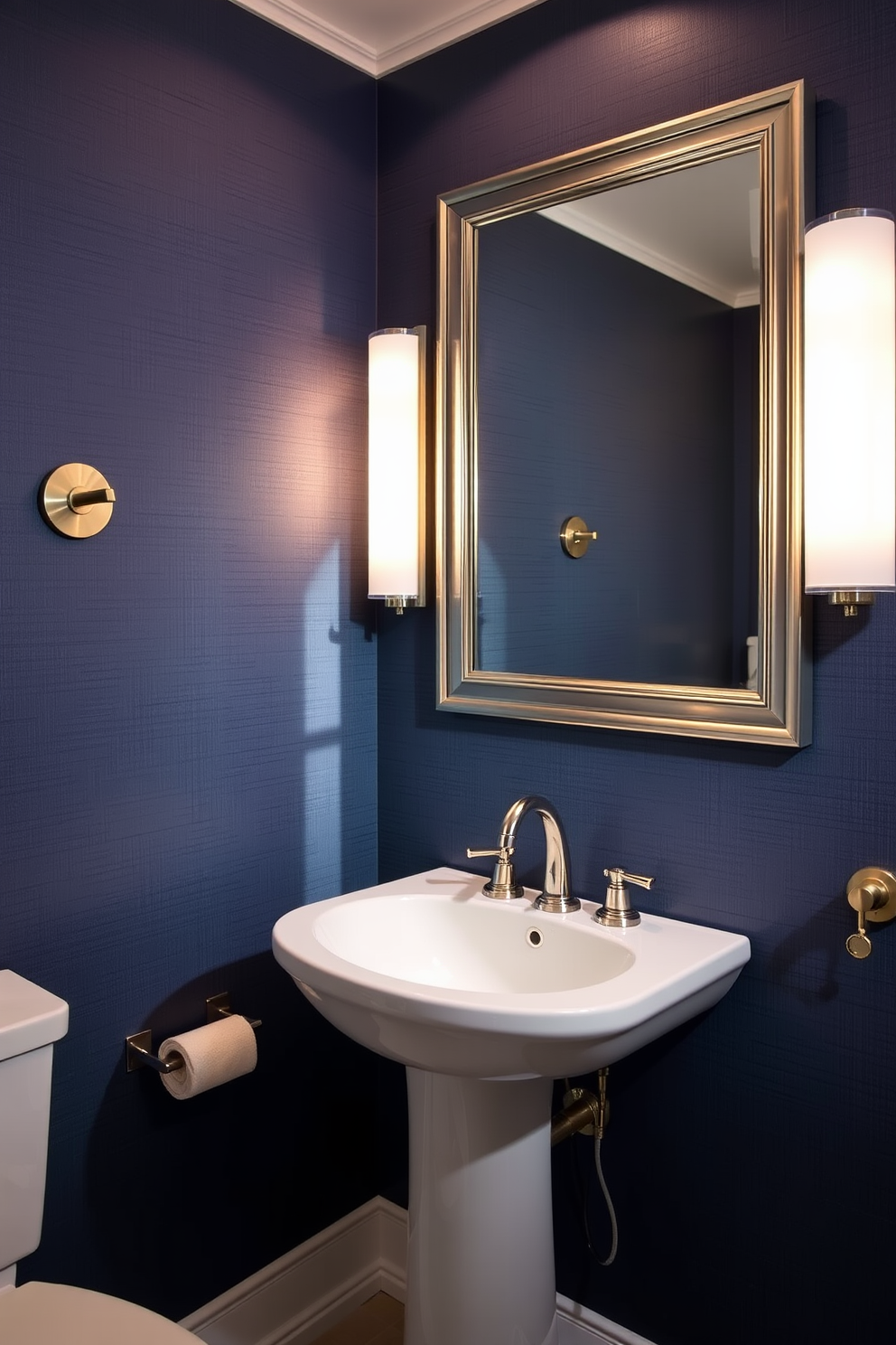 A luxurious powder room featuring high-end fixtures in polished nickel. The space is adorned with a sleek pedestal sink and a stylish wall-mounted faucet, both showcasing the elegance of polished nickel finishes. The walls are covered in a rich, deep blue wallpaper with a subtle texture, creating a sophisticated backdrop. A large, framed mirror with a polished nickel border reflects the ambient lighting, enhancing the room's upscale feel.