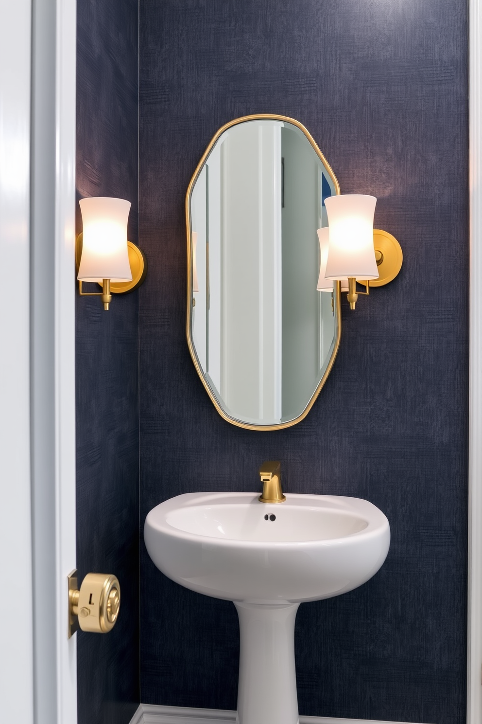 Stylish sconces for soft illumination. The sconces are elegantly designed with a brushed gold finish and frosted glass shades, providing a warm, inviting glow. Luxury powder room design ideas. The space features a rich navy blue wallpaper with a subtle texture, complemented by a sleek white pedestal sink and a vintage-style mirror.