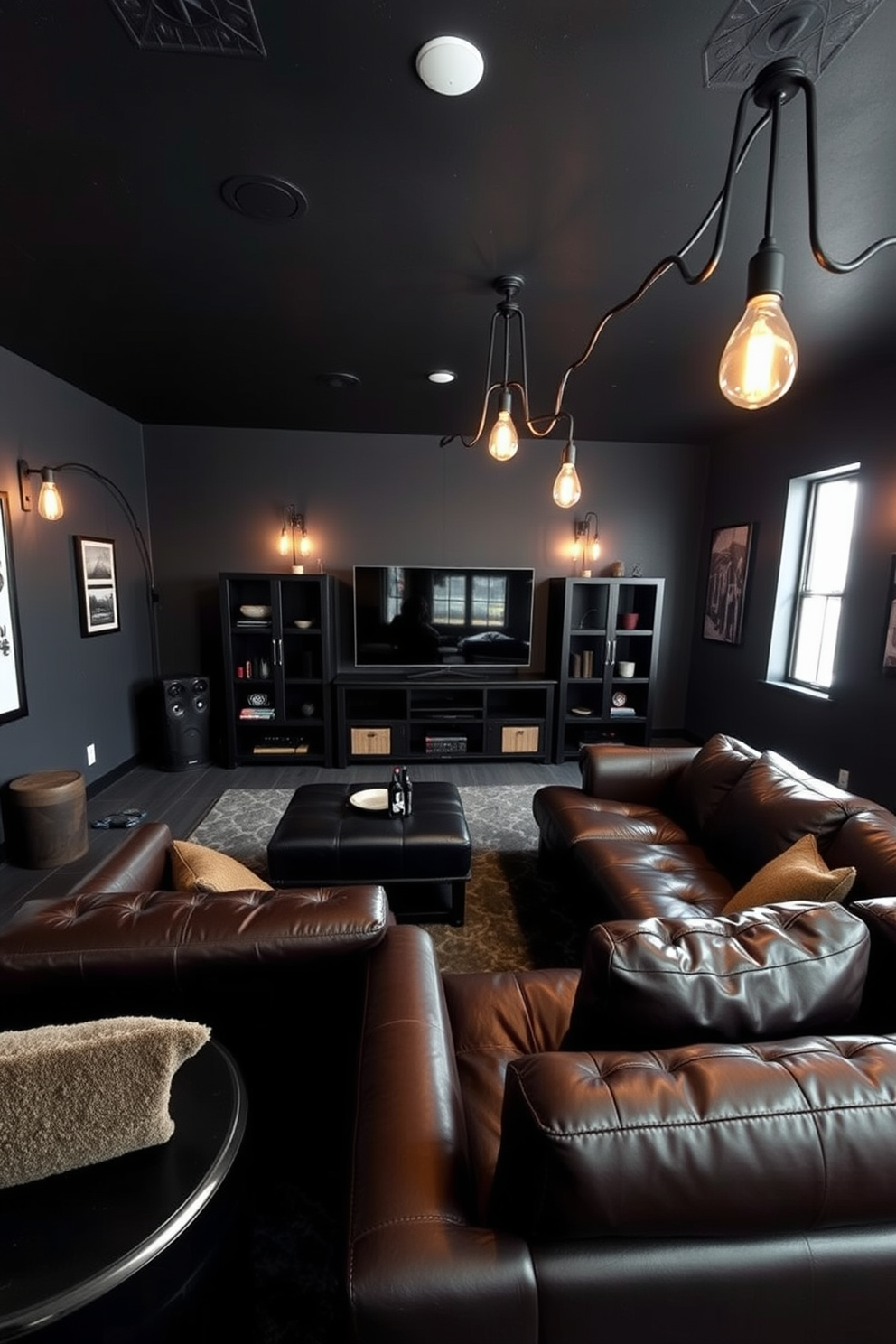 A dark and moody man cave designed for relaxation and entertainment. The walls are painted in a deep charcoal gray, complemented by rich leather furniture and industrial-style accents. A large sectional sofa in dark brown leather faces a sleek black entertainment center. Ambient lighting is provided by vintage-style Edison bulbs hanging from the ceiling, creating a warm and inviting atmosphere.