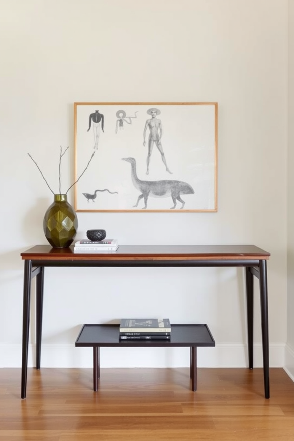 A sleek console table stands against the wall in a Mid Century Modern foyer. The table is adorned with a geometric vase and a small stack of art books, creating an inviting atmosphere.