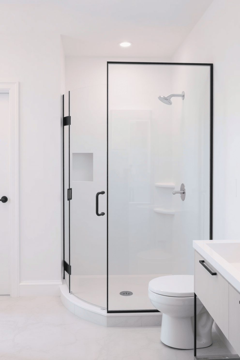 A minimalist bathroom design featuring a glass shower enclosure that enhances the sense of space. The walls are painted in a soft white hue, and the floor is adorned with light gray tiles for a clean and airy atmosphere.