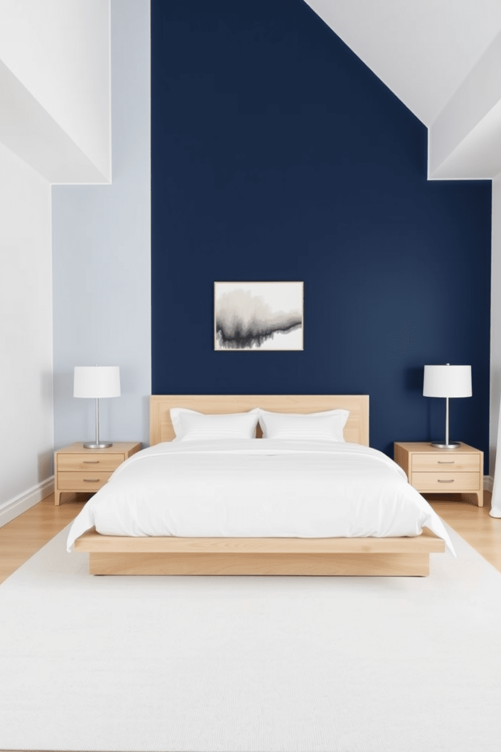 A minimalist bedroom featuring a simple color block design. The walls are painted in a soft white, while one accent wall showcases a bold navy blue. The bed is centered in the room with a low-profile frame and crisp white bedding. A pair of bedside tables in light wood flanks the bed, each topped with a sleek lamp. A large area rug in a neutral tone anchors the space, adding warmth without clutter. A single piece of abstract art hangs above the bed, providing a focal point without overwhelming the simplicity of the design.