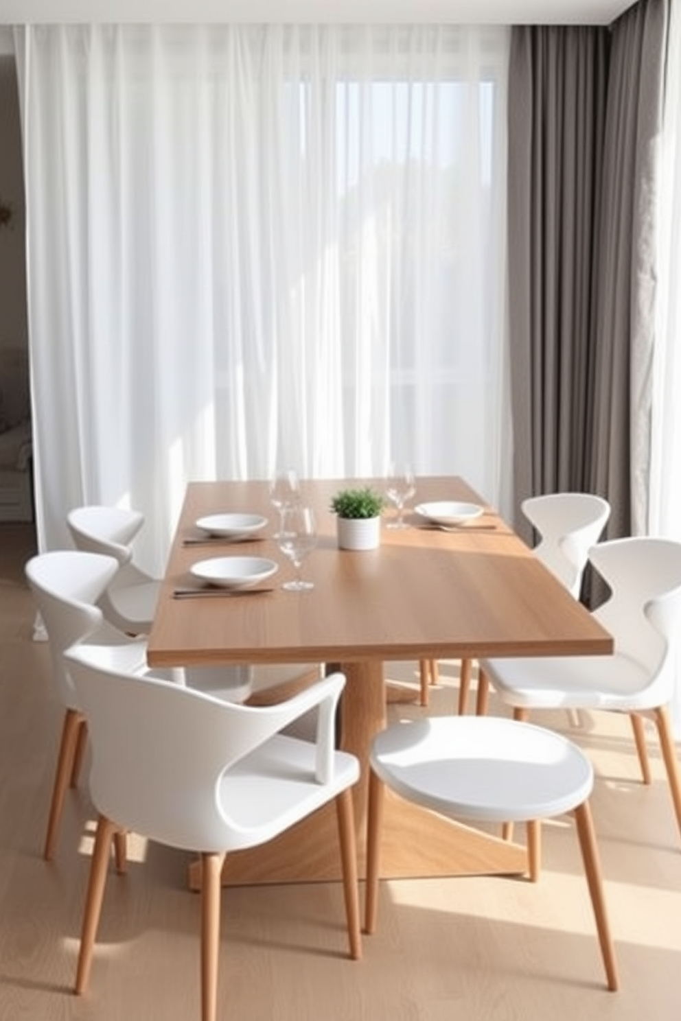 A minimalist dining room features a sleek wooden table with clean lines surrounded by simple white chairs. The table is set with understated tableware, including plain white plates, clear glassware, and minimalist cutlery arranged neatly. Soft natural light filters through sheer curtains, illuminating the space and highlighting the simplicity of the decor. A single centerpiece, such as a small potted plant, adds a touch of greenery without overwhelming the aesthetic.