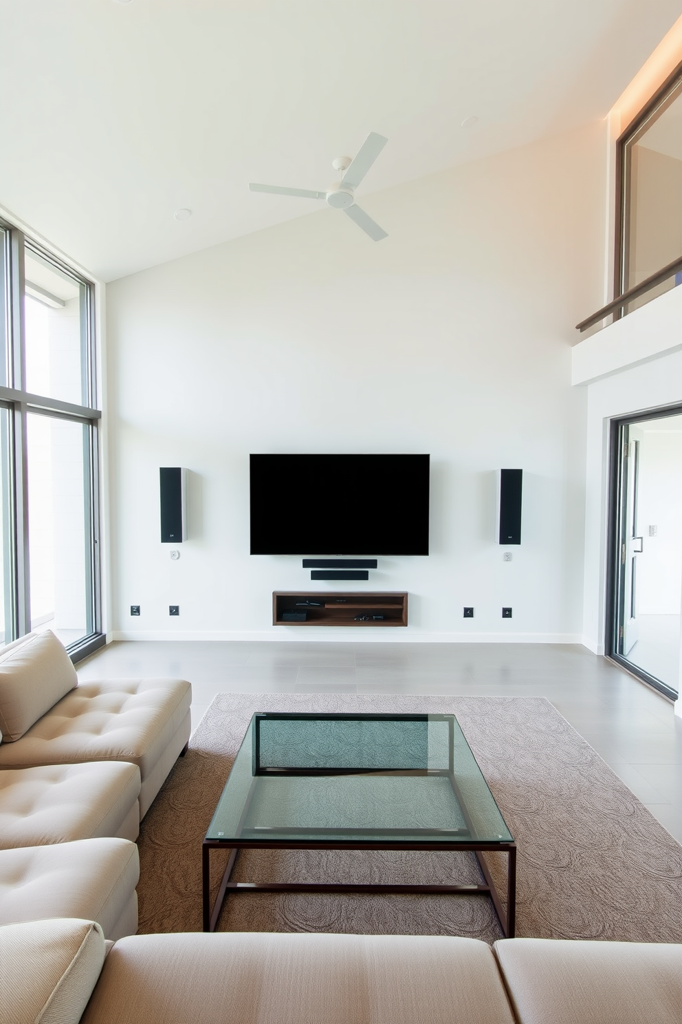 A minimalist family room designed for comfort and functionality. The space features a large sectional sofa in a neutral tone, complemented by a sleek coffee table made of glass and metal. Integrated technology includes a wall-mounted smart TV and hidden speakers, maintaining a clean aesthetic. Large windows allow natural light to flood the room, enhancing the airy feel of the design.