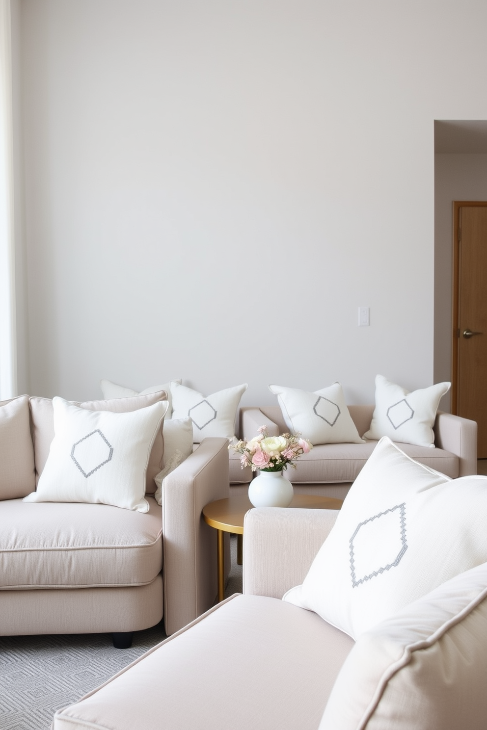 A minimalist family room featuring soft furnishings adorned with simple geometric patterns. The color palette consists of neutral tones, creating a serene and inviting atmosphere.