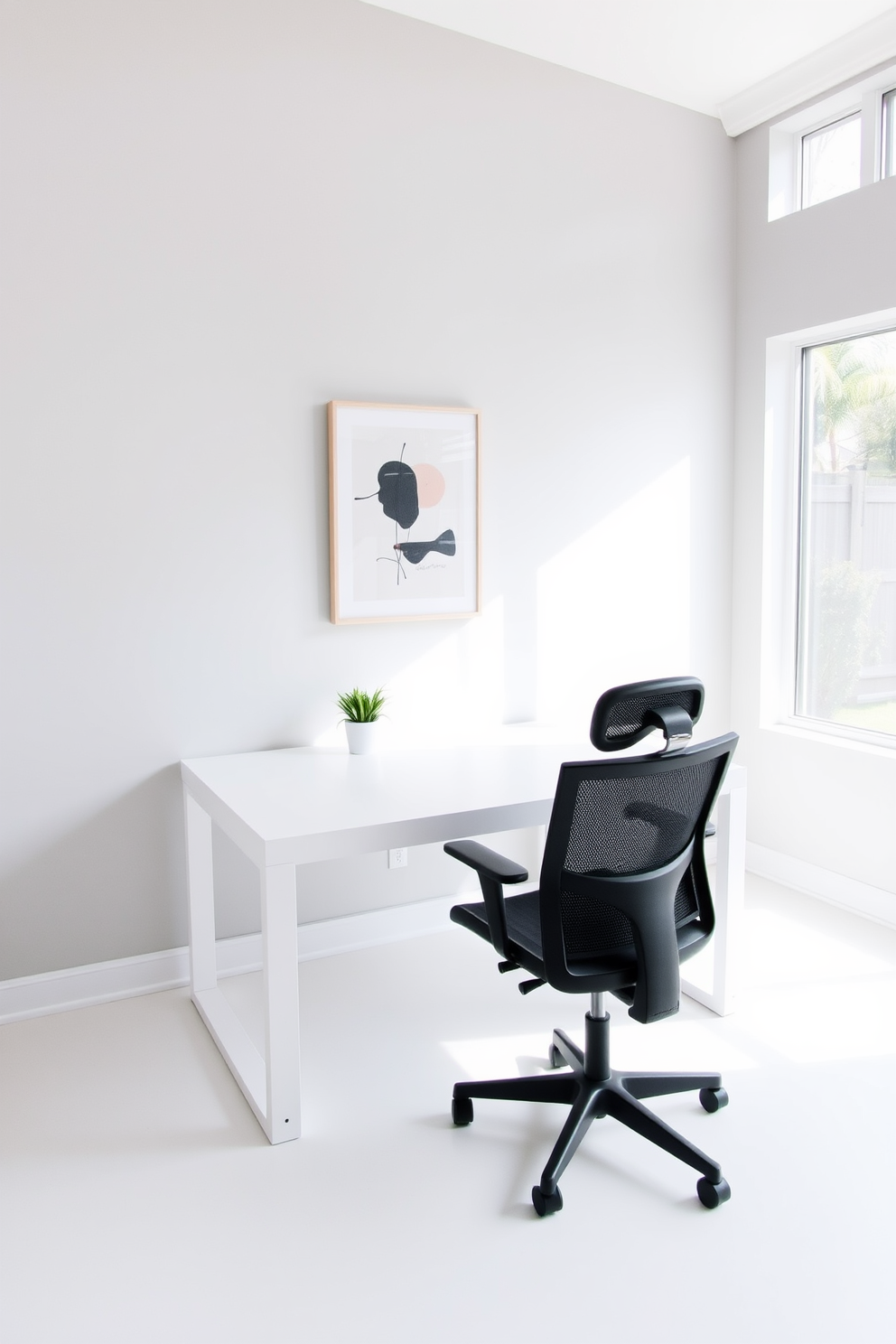 A minimalist home office featuring a sleek, white desk with clean lines and a comfortable ergonomic chair. The walls are painted in soft gray, and a single piece of abstract art hangs above the desk, adding a touch of creativity. Natural light floods the space through large windows, illuminating the room and creating an inviting atmosphere. A small indoor plant sits on the desk, bringing a hint of greenery to the otherwise neutral palette.