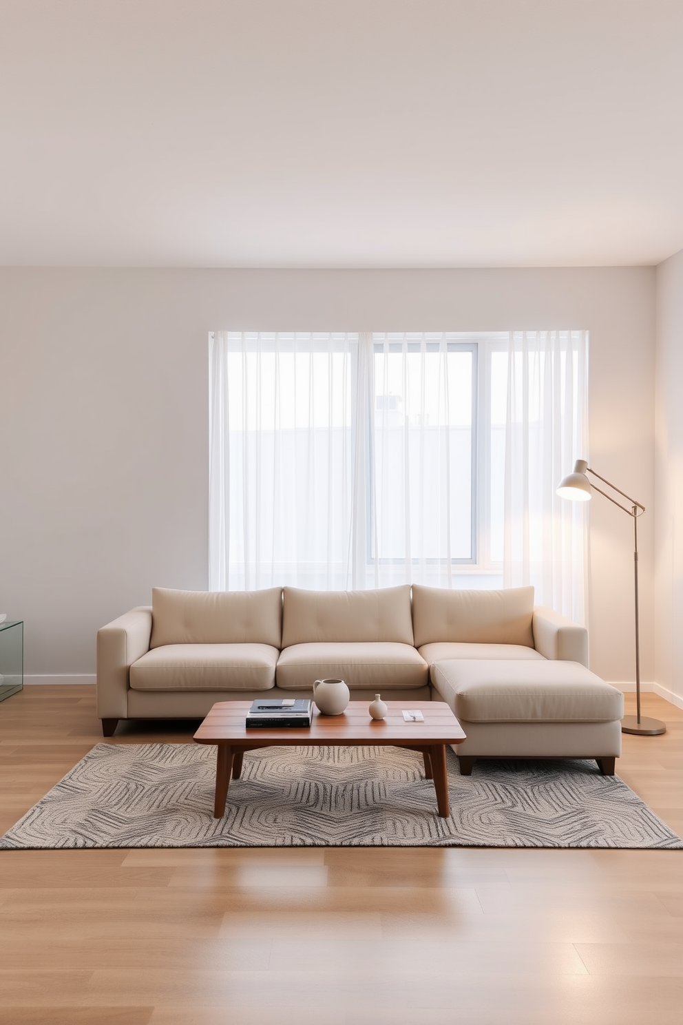 A minimalist living room featuring a soft beige sectional sofa positioned in the center. A sleek wooden coffee table sits in front of the sofa, complemented by a simple black and white rug beneath. The walls are painted in a light gray tone, creating a serene backdrop. A large window allows natural light to flood the space, with sheer white curtains gently framing the view. Warm lighting is provided by a modern floor lamp with a soft glow, enhancing the inviting ambiance. A few carefully chosen decorative items are placed on the coffee table, adding a touch of personality without cluttering the space.