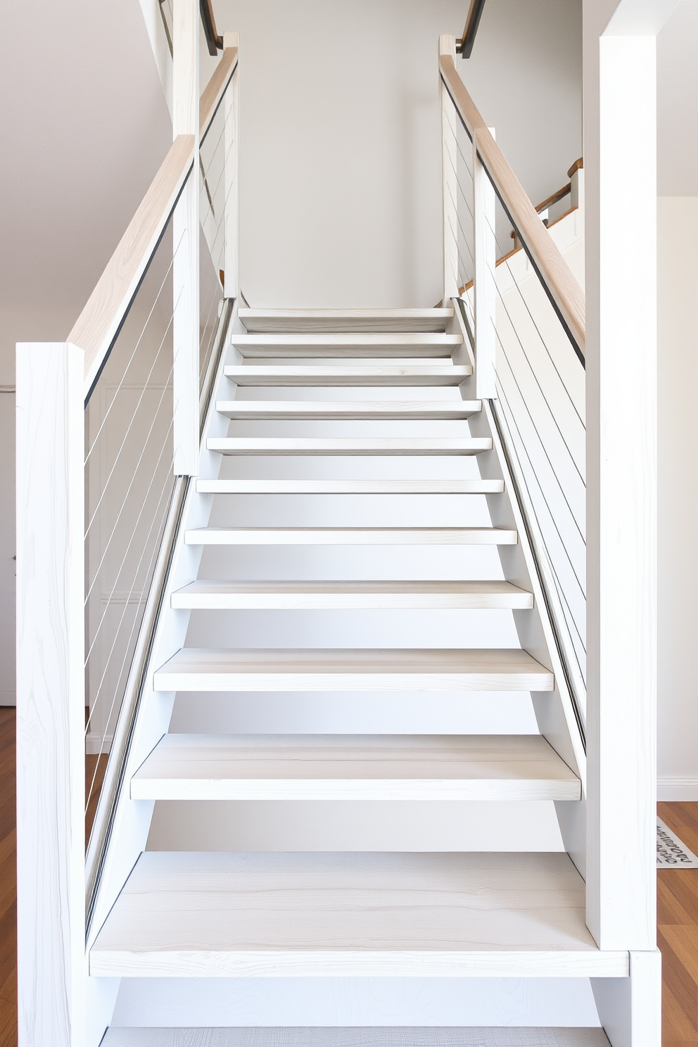 A minimalist staircase design featuring whitewashed wooden treads that enhance the brightness of the space. The open risers create a sense of airiness, complemented by sleek metal railings that add a modern touch.