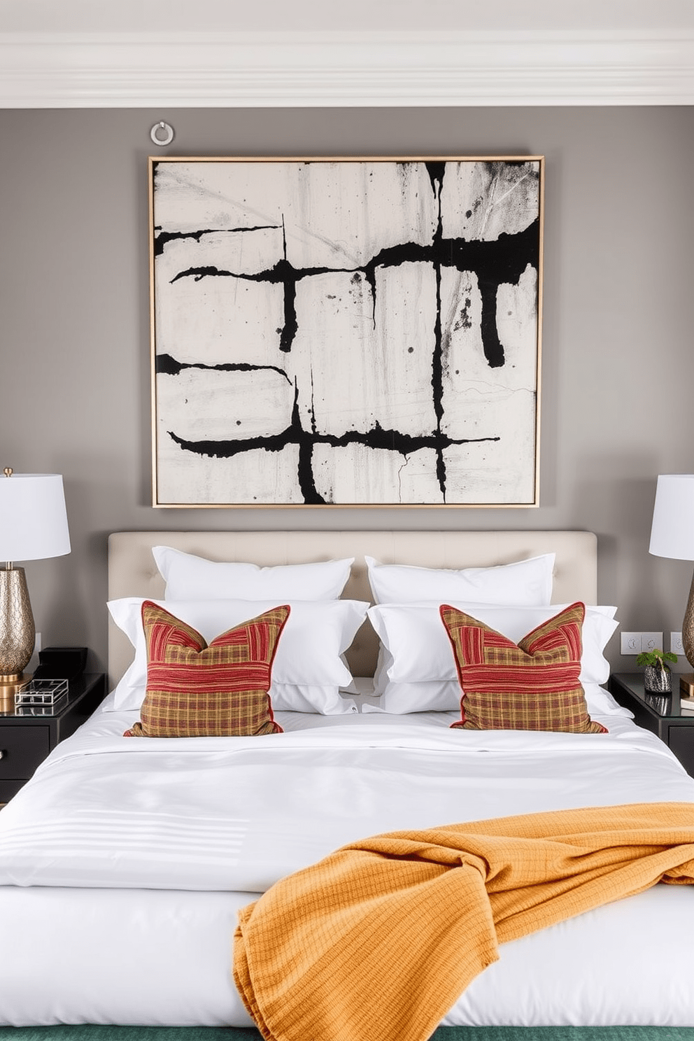 A modern bedroom featuring a large statement art piece above the bed. The walls are painted in a soft gray tone, and the bed is dressed in crisp white linens with colorful accent pillows.