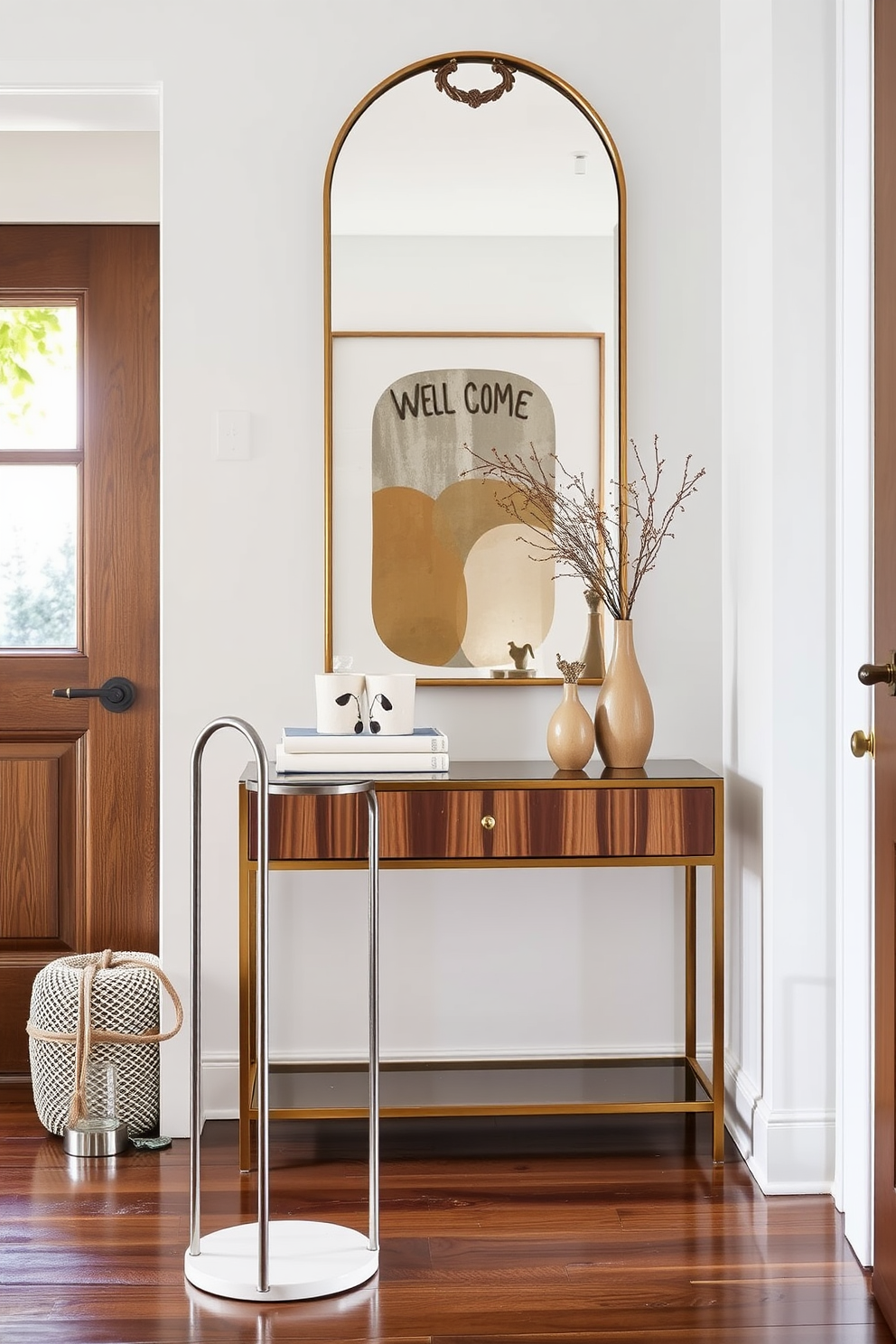 A stylish umbrella stand designed for rainy days. It features a sleek metal frame with a minimalist aesthetic, complemented by a ceramic base to catch excess water. The entryway is bright and welcoming, showcasing a blend of contemporary art and natural elements. A console table with a decorative mirror above adds functionality and elegance to the space.