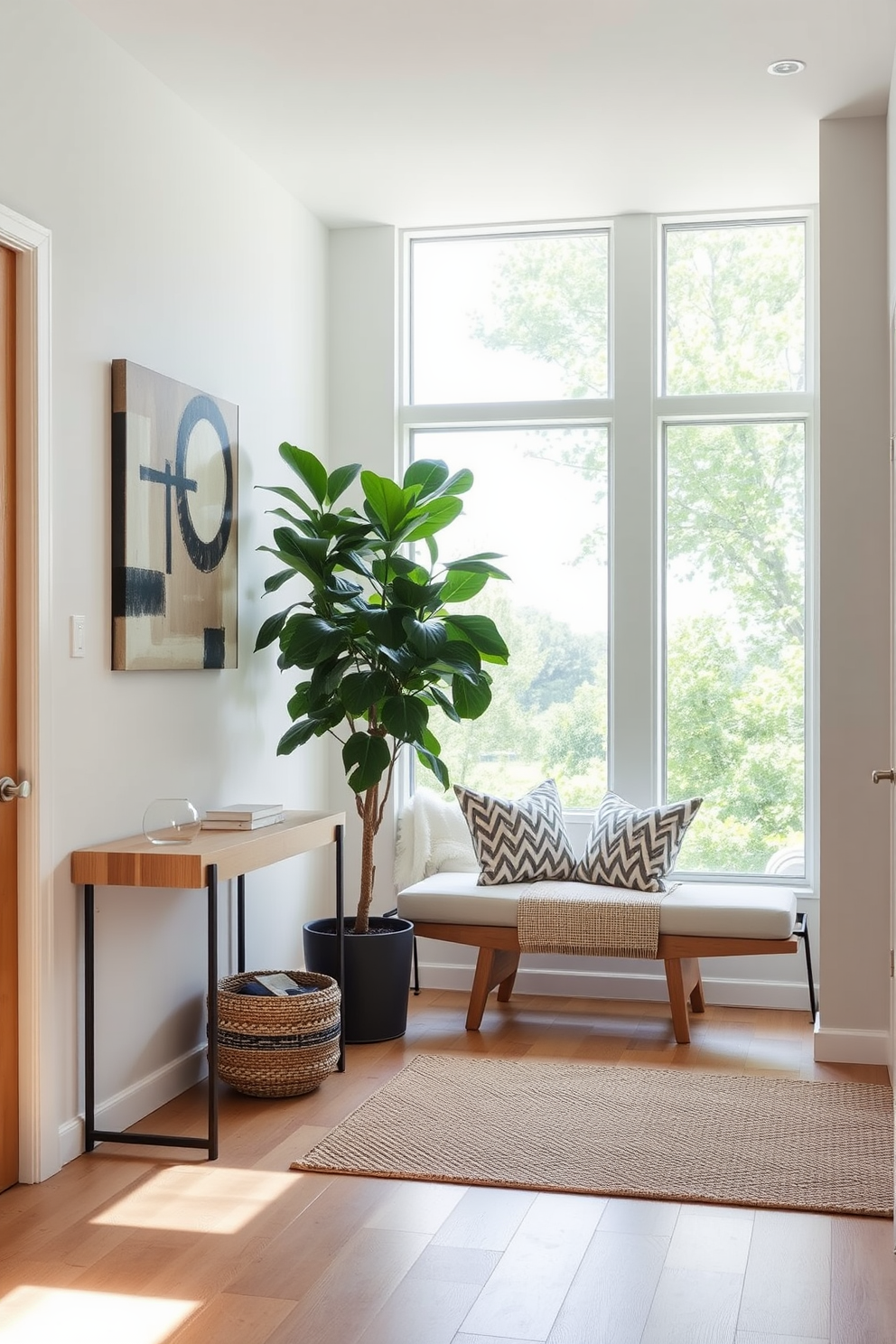 A modern entryway with a sleek console table made of light wood. The walls are adorned with abstract art, and a large indoor plant sits in a stylish pot next to the entrance. Natural light floods the space through a large window, highlighting a cozy bench with decorative cushions. A woven rug adds warmth to the floor, creating an inviting atmosphere.