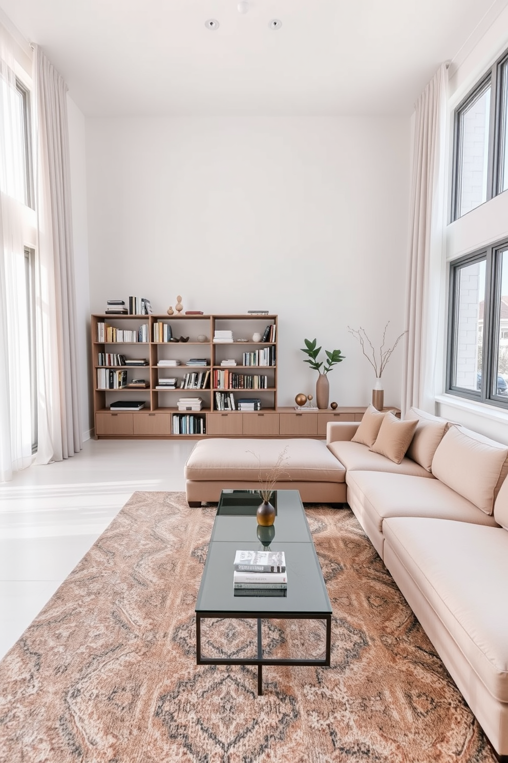 A minimalist family room features a large sectional sofa in a neutral tone, complemented by a sleek coffee table made of glass and metal. The walls are painted white, enhancing the natural light that floods the space through large windows adorned with simple sheer curtains. In one corner, a stylish bookshelf displays a curated selection of books and decorative items, maintaining a clean and organized look. A soft area rug anchors the seating area, adding warmth and texture to the overall design while keeping the space functional and inviting.