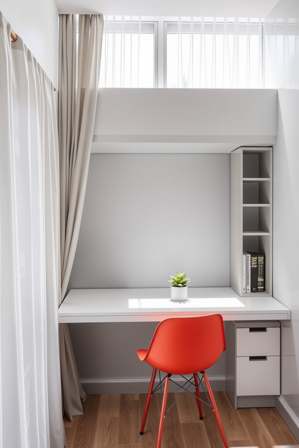 A modern home office designed for small spaces features a sleek desk positioned against a wall with built-in shelving above. Natural light floods the area through sheer curtains, creating a bright and inviting atmosphere. The color palette includes soft grays and whites, with a pop of color from a vibrant desk chair. A small potted plant sits on the desk, adding a touch of greenery to the minimalist decor.