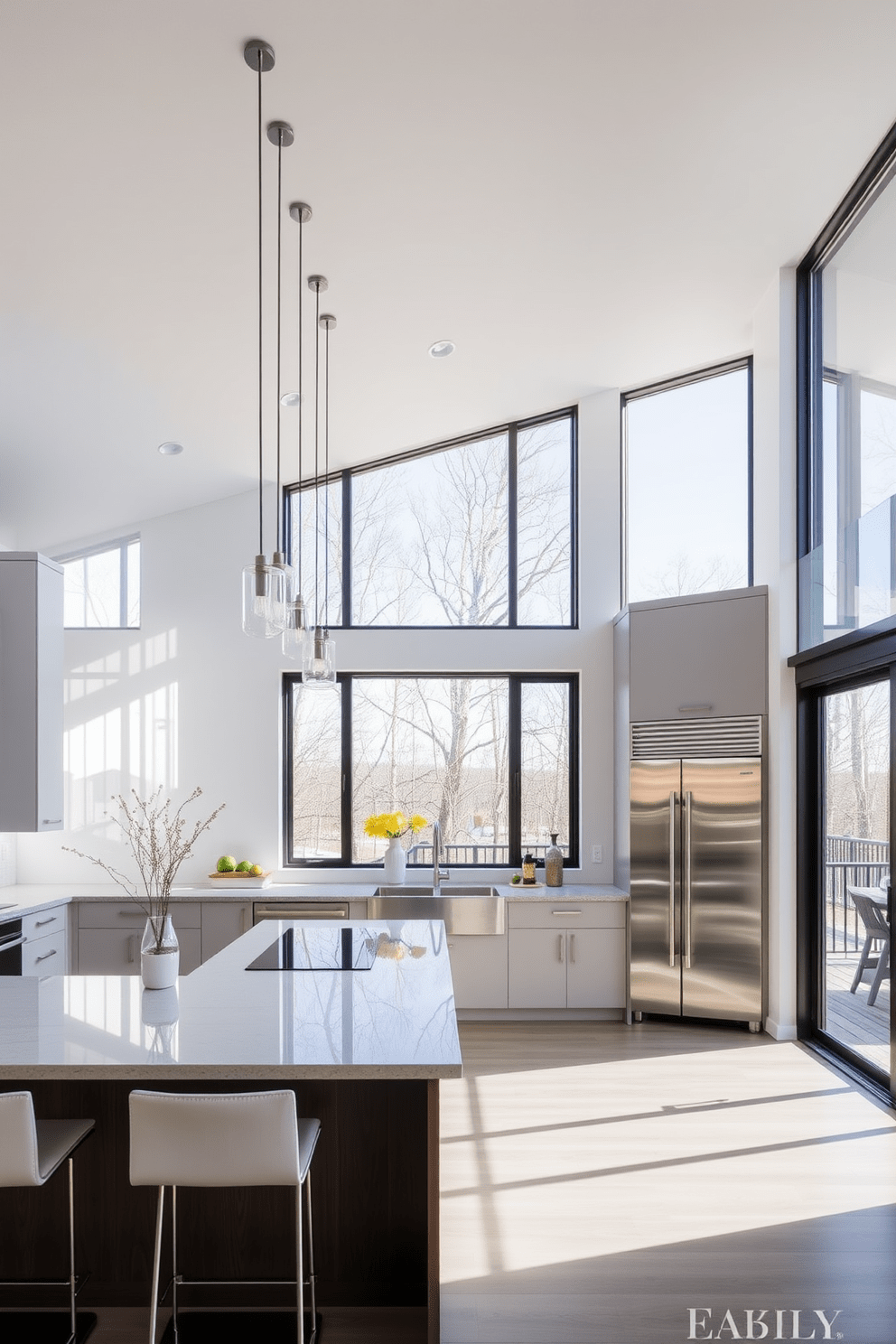 A modern kitchen featuring large windows that flood the space with natural light. The design includes sleek cabinetry, a spacious island with bar seating, and high-end stainless steel appliances.