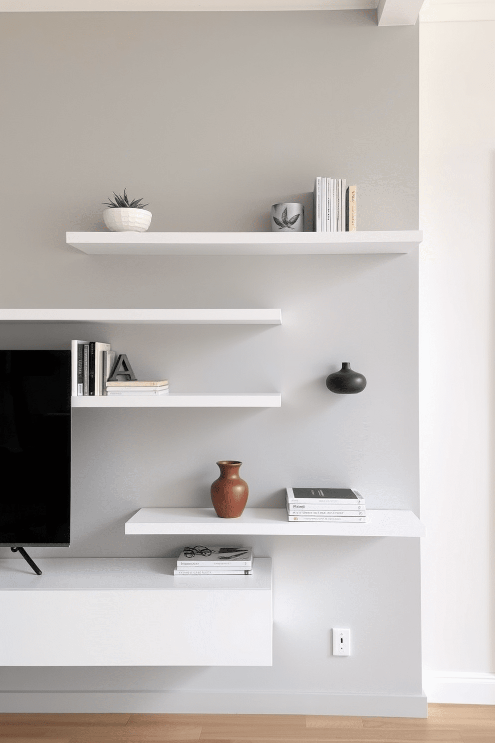 A modern living room features sleek wall-mounted shelves that maximize space while showcasing decorative items. The shelves are painted in a soft white color, complementing the light gray walls and creating an airy feel.