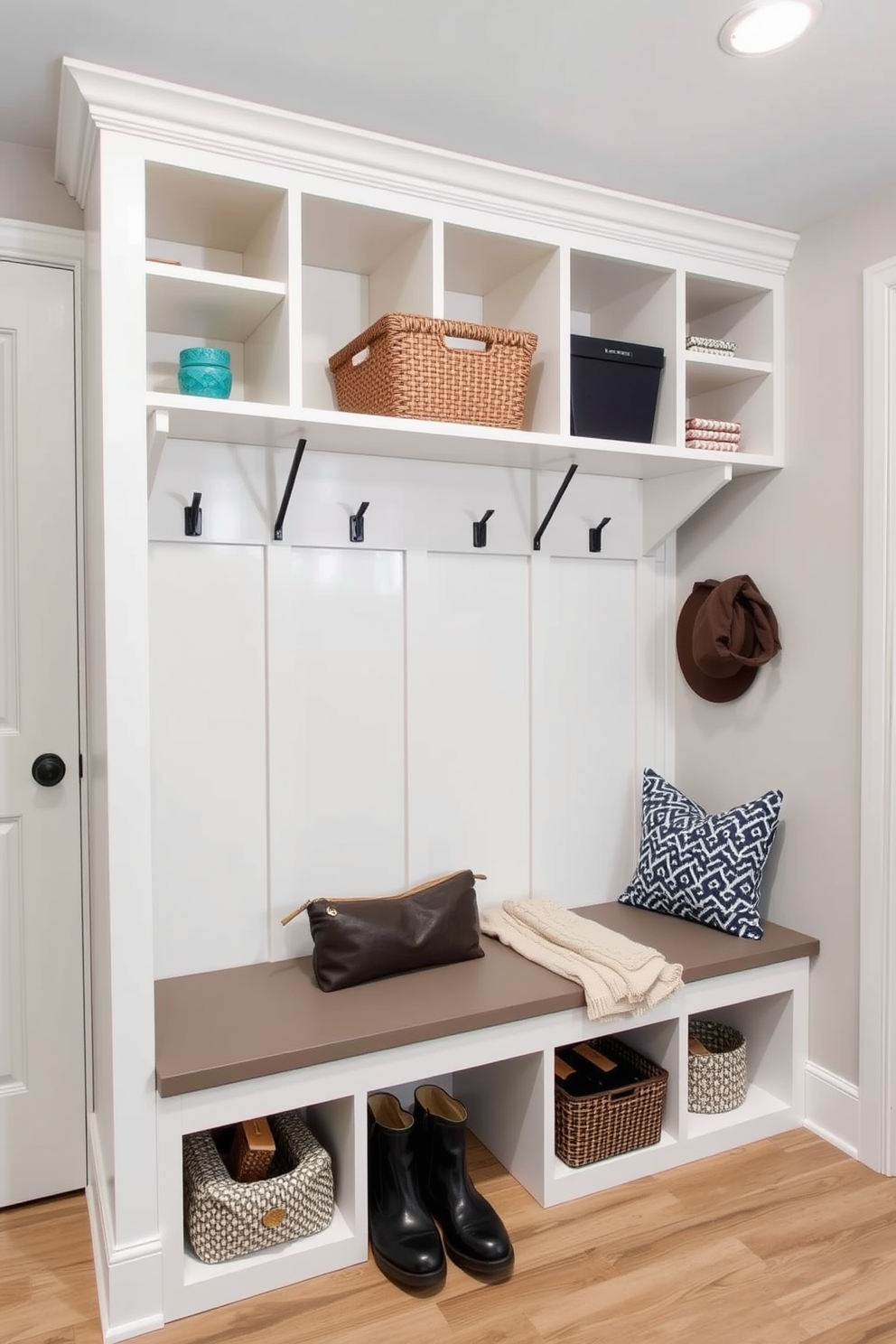 A modern mudroom features open shelving that provides easy access to frequently used items. The design incorporates a bench with storage underneath, allowing for a clutter-free space while adding a touch of style.