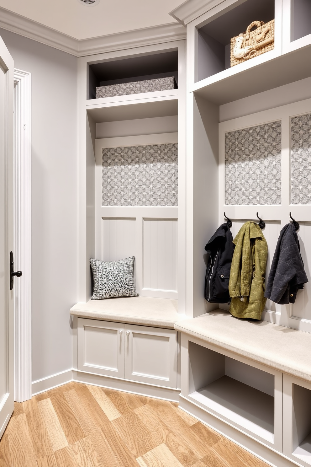 A modern mudroom design featuring hidden storage behind decorative panels. The space includes built-in benches with plush cushions and hooks for hanging coats, all seamlessly integrated into the wall design.