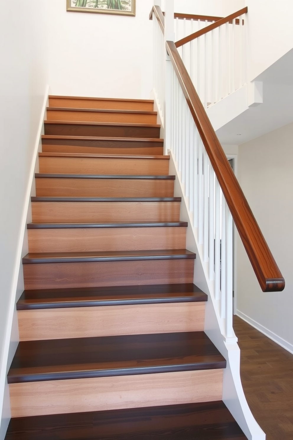 A modern staircase with a two-tone design featuring a sleek wooden handrail. The steps alternate between light and dark wood, creating a striking visual contrast that enhances the overall aesthetic of the entryway.