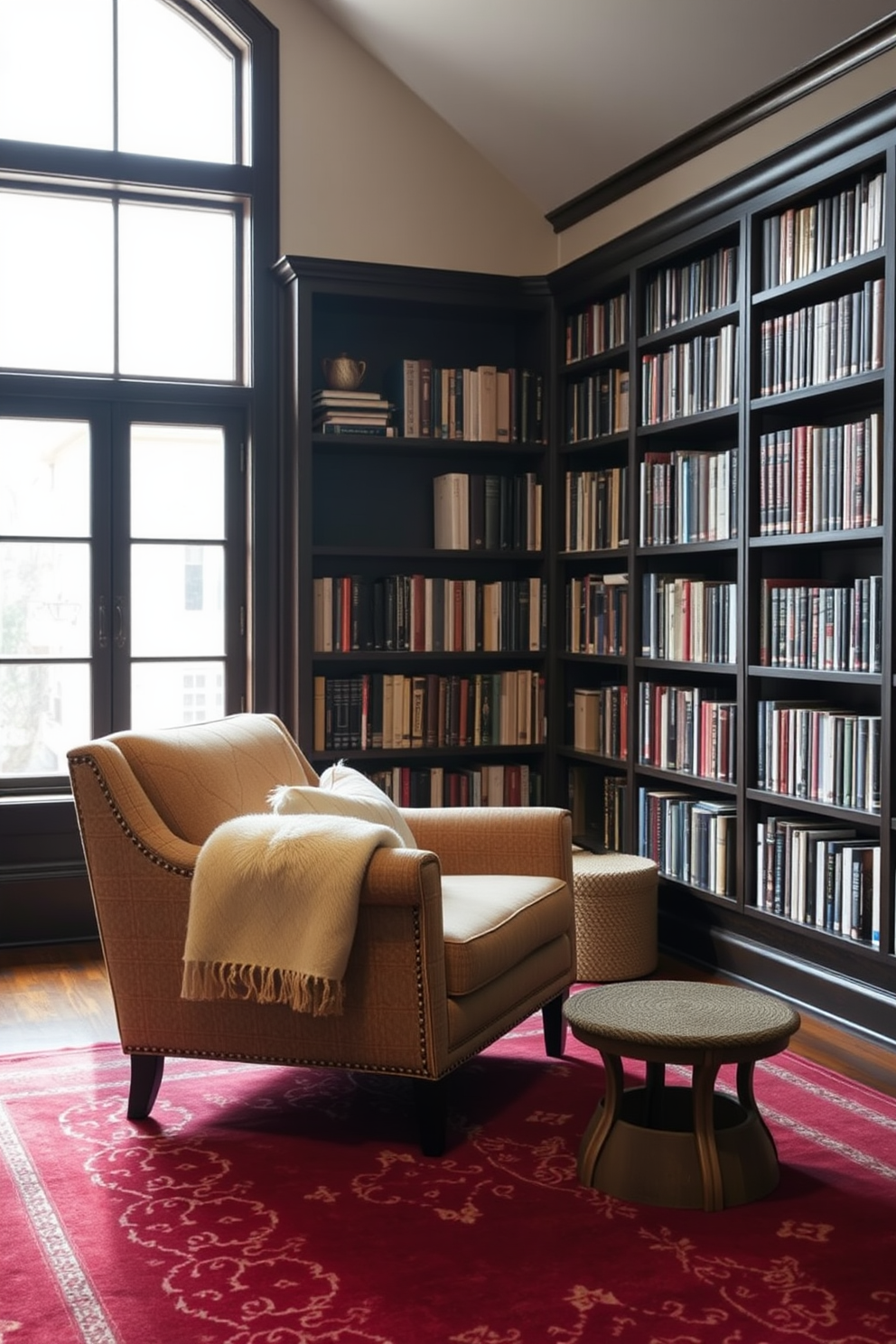 Cozy armchair positioned near a large window allowing natural light to fill the space. The armchair features soft, textured fabric and is complemented by a plush throw blanket draped over one side. The home library is designed with dark wooden bookshelves lined with books of various sizes. A rich area rug anchors the seating area, and warm lighting creates an inviting atmosphere for reading.