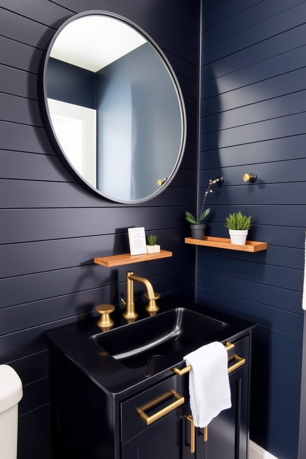 Accent wall with dark shiplap boards. The room features a sleek black sink with gold fixtures and a large round mirror above it. The walls are painted in a deep navy color, creating a dramatic contrast with the shiplap. A small wooden shelf holds decorative items and a potted plant, adding a touch of warmth to the space.