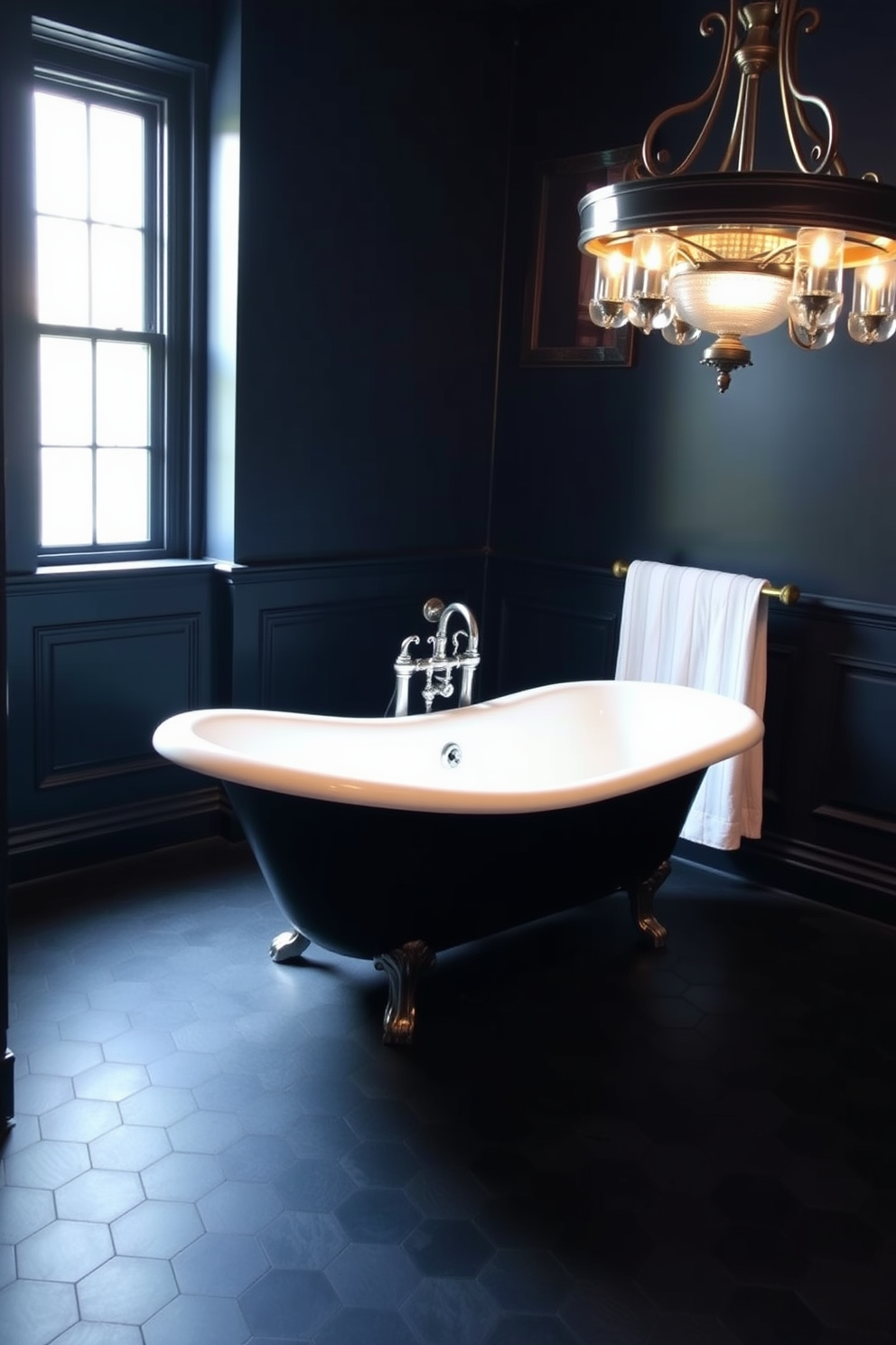 Classic clawfoot tub in a moody setting. The walls are painted in a deep navy blue, and the floor is covered with dark hexagonal tiles. Soft, ambient lighting illuminates the space, highlighting the intricate details of the tub's design. A vintage chandelier hangs overhead, adding a touch of elegance to the room.