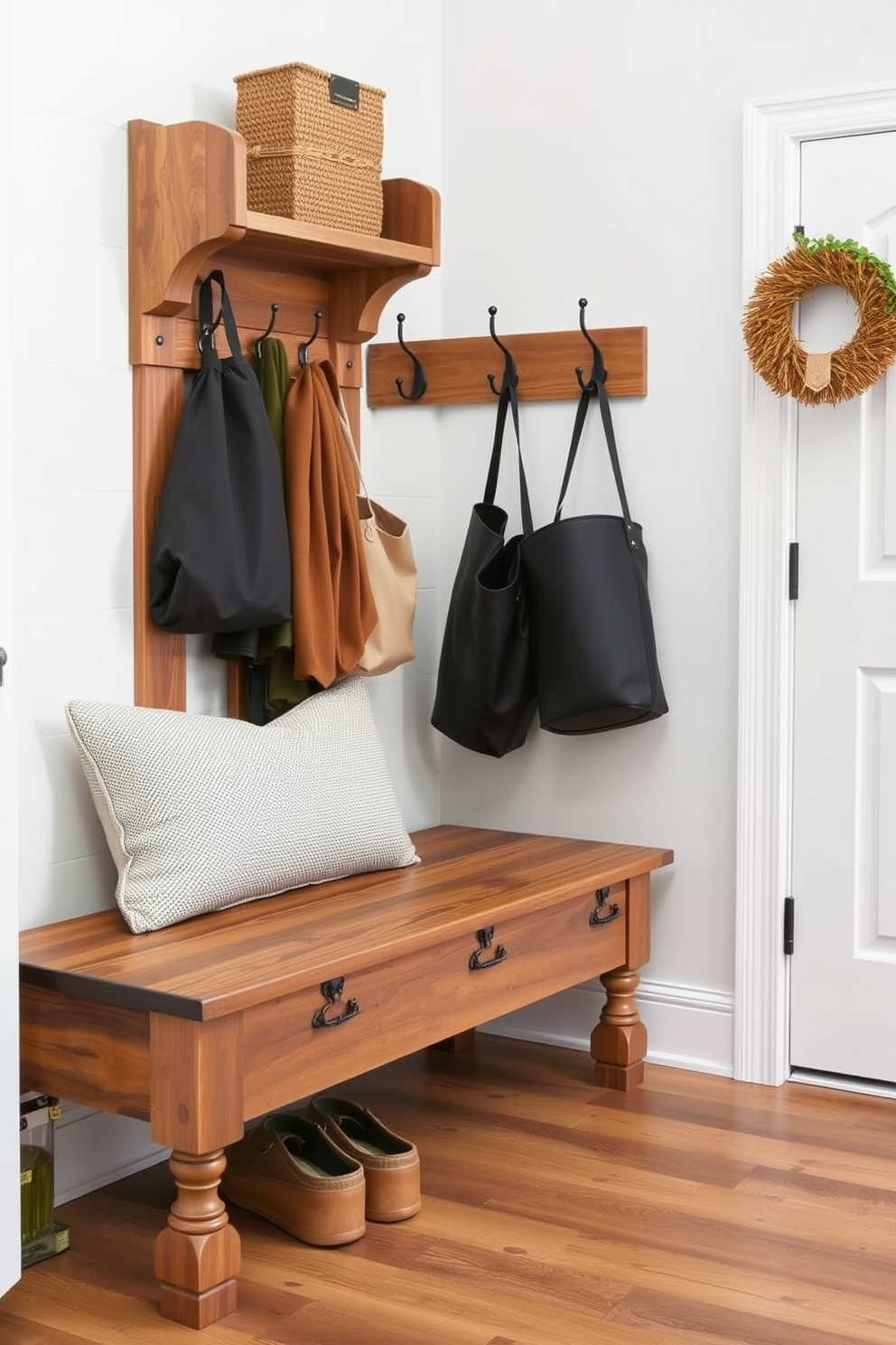 A reclaimed wood bench with a distressed finish sits prominently in a stylish mudroom. The bench features a comfortable cushion upholstered in a neutral fabric, complemented by hooks on the wall for hanging coats and bags.