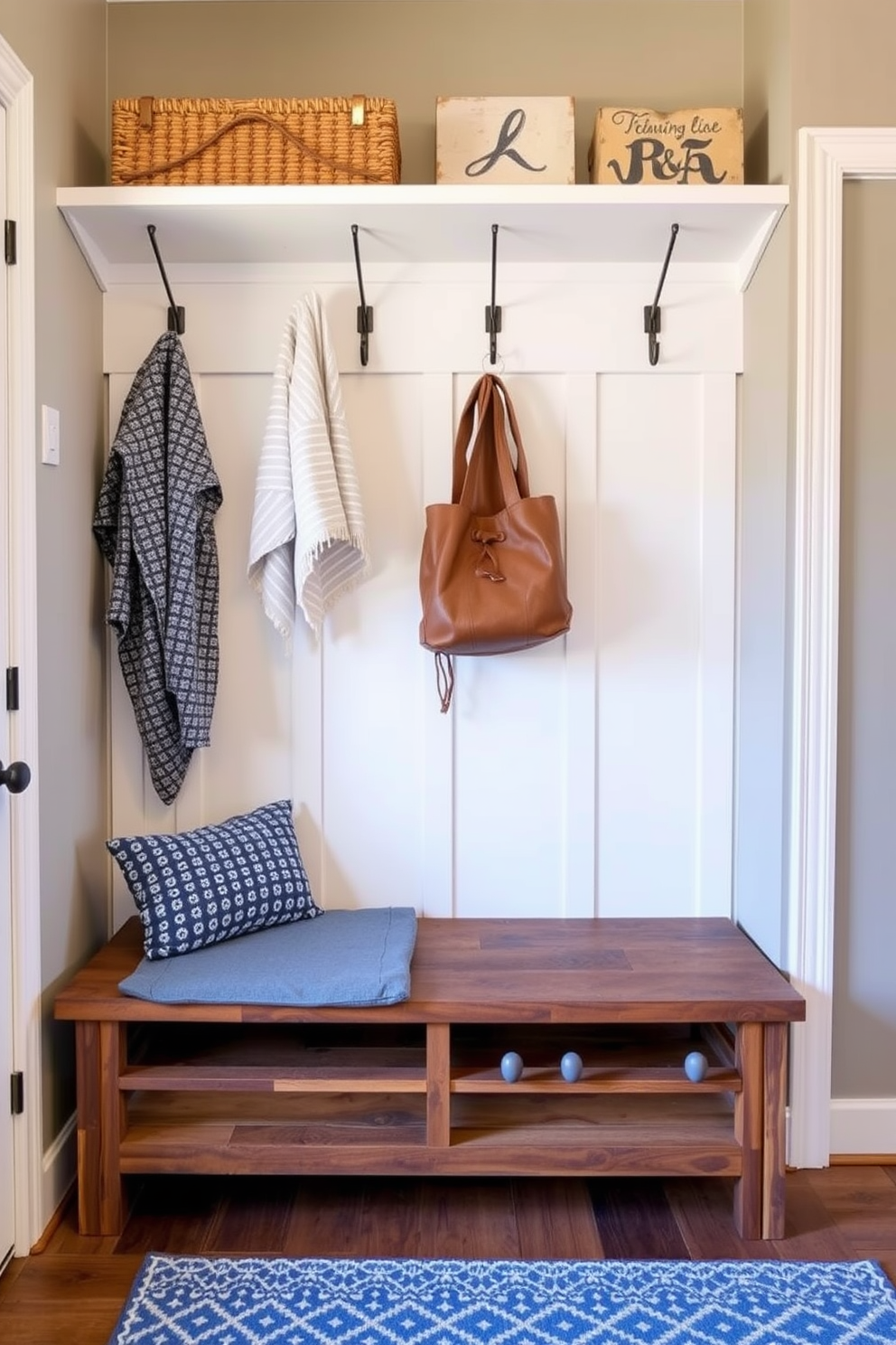 A stylish mudroom features a bench with a removable cushion for easy cleaning. The bench is crafted from reclaimed wood and is paired with hooks for hanging coats and bags.