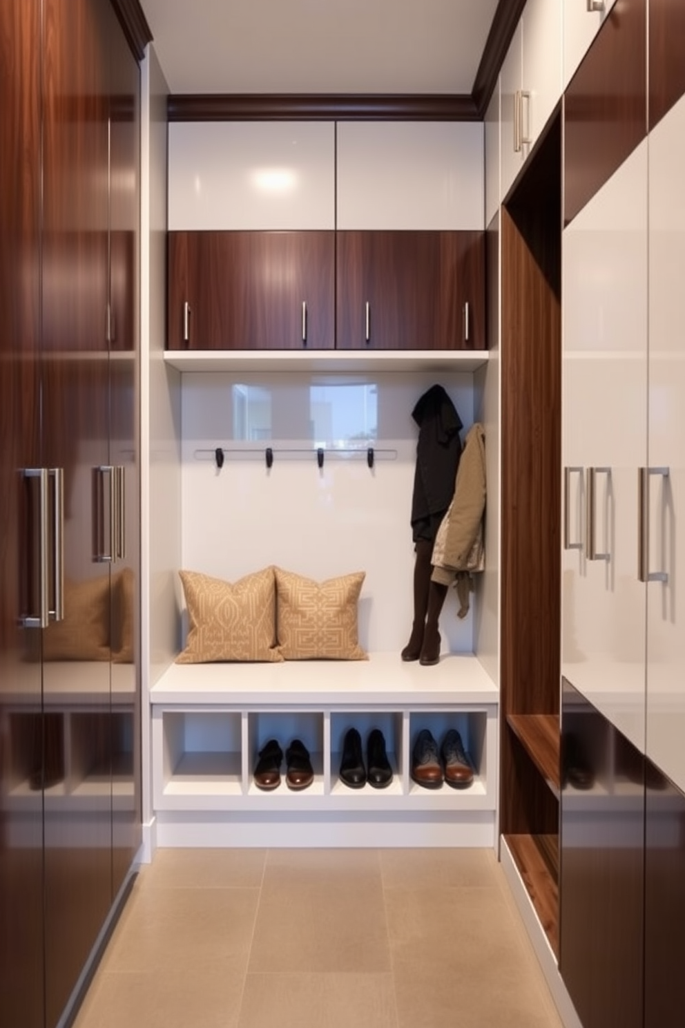 Sleek cabinetry lines the walls of a modern mudroom, featuring a combination of dark wood and glossy white finishes for a striking contrast. A built-in bench with plush cushions provides a comfortable seating area, while hooks and cubbies organize shoes and outerwear efficiently.