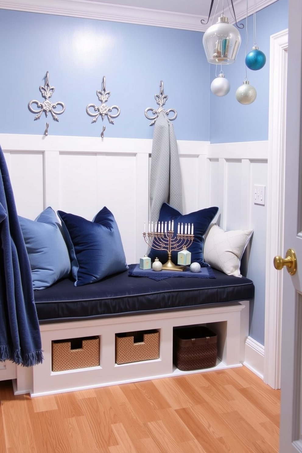 Cozy blue and silver color scheme mudroom featuring a built-in bench with plush cushions in soft blue fabric. The walls are adorned with silver accents and decorative hooks for hanging winter coats and scarves. Hanukkah decorating ideas include a beautifully arranged display of menorahs and dreidels on the bench. Soft blue and silver ornaments are hung in the mudroom, creating a festive and welcoming atmosphere.