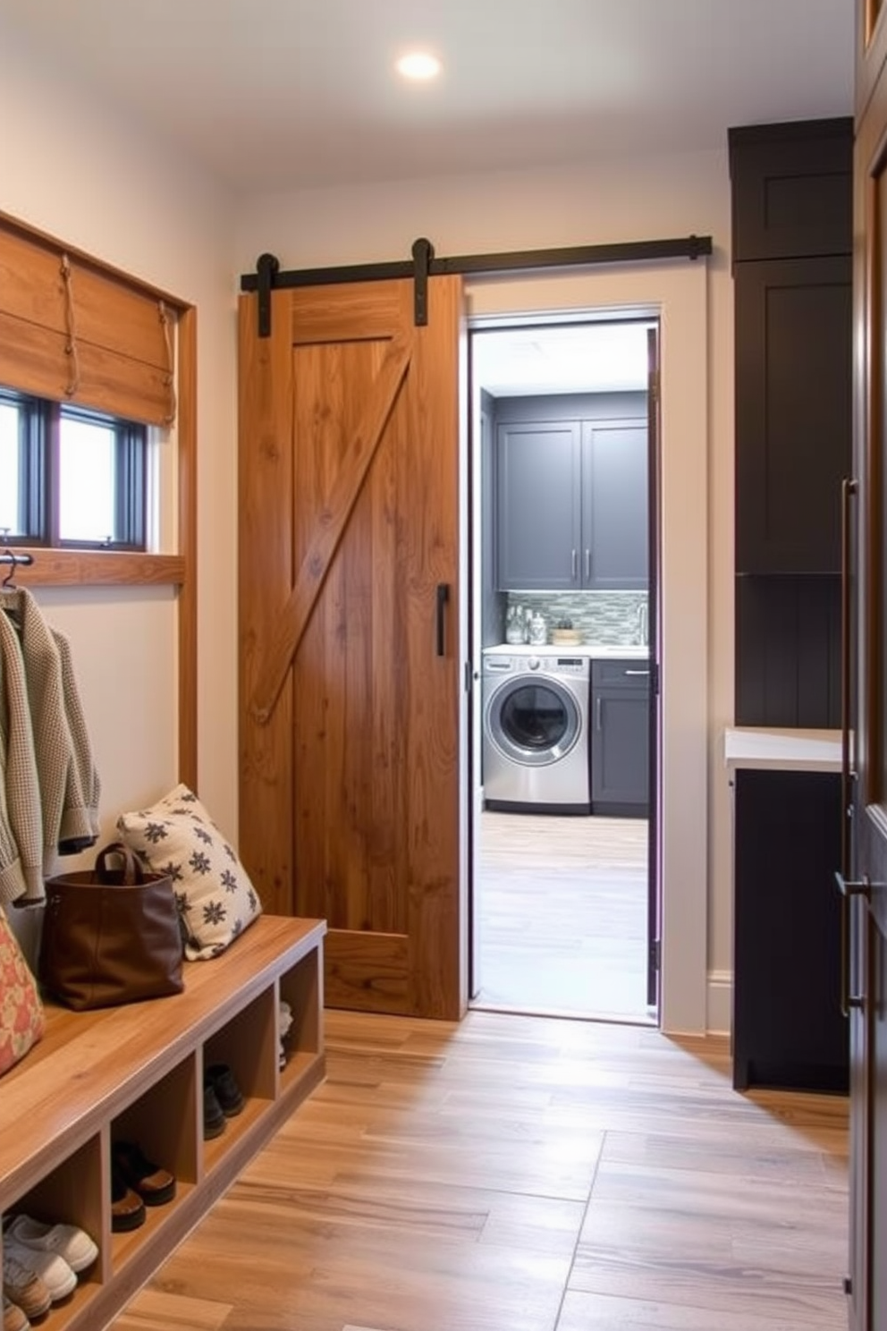 A welcoming mudroom features a sliding barn door entrance that adds rustic charm. Inside, built-in benches with storage underneath provide a functional space for shoes and bags. The laundry room is designed with sleek cabinetry and a countertop for folding clothes. A stylish backsplash and modern appliances create an efficient and aesthetically pleasing environment.