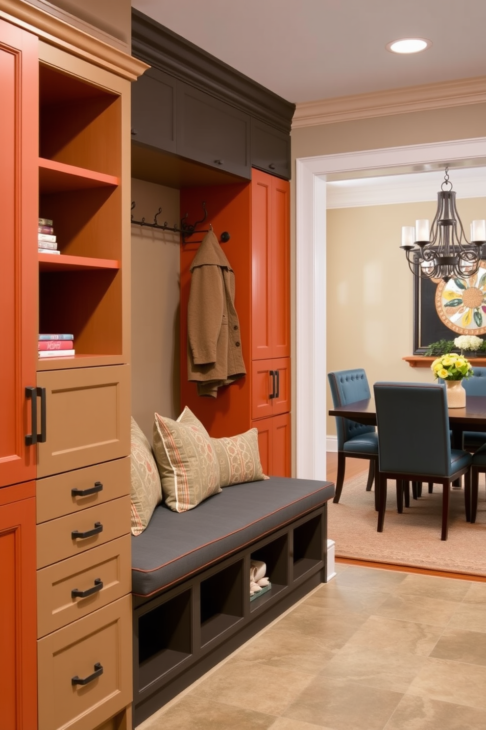 A mudroom design adjacent to the dining room features cabinetry in contrasting colors to create visual interest. The cabinetry includes open shelves for decorative storage and closed cabinets for practical organization. The space is equipped with a built-in bench for seating, adorned with plush cushions in coordinating colors. A stylish coat rack hangs above the bench, and the flooring is a durable tile that complements the overall aesthetic.